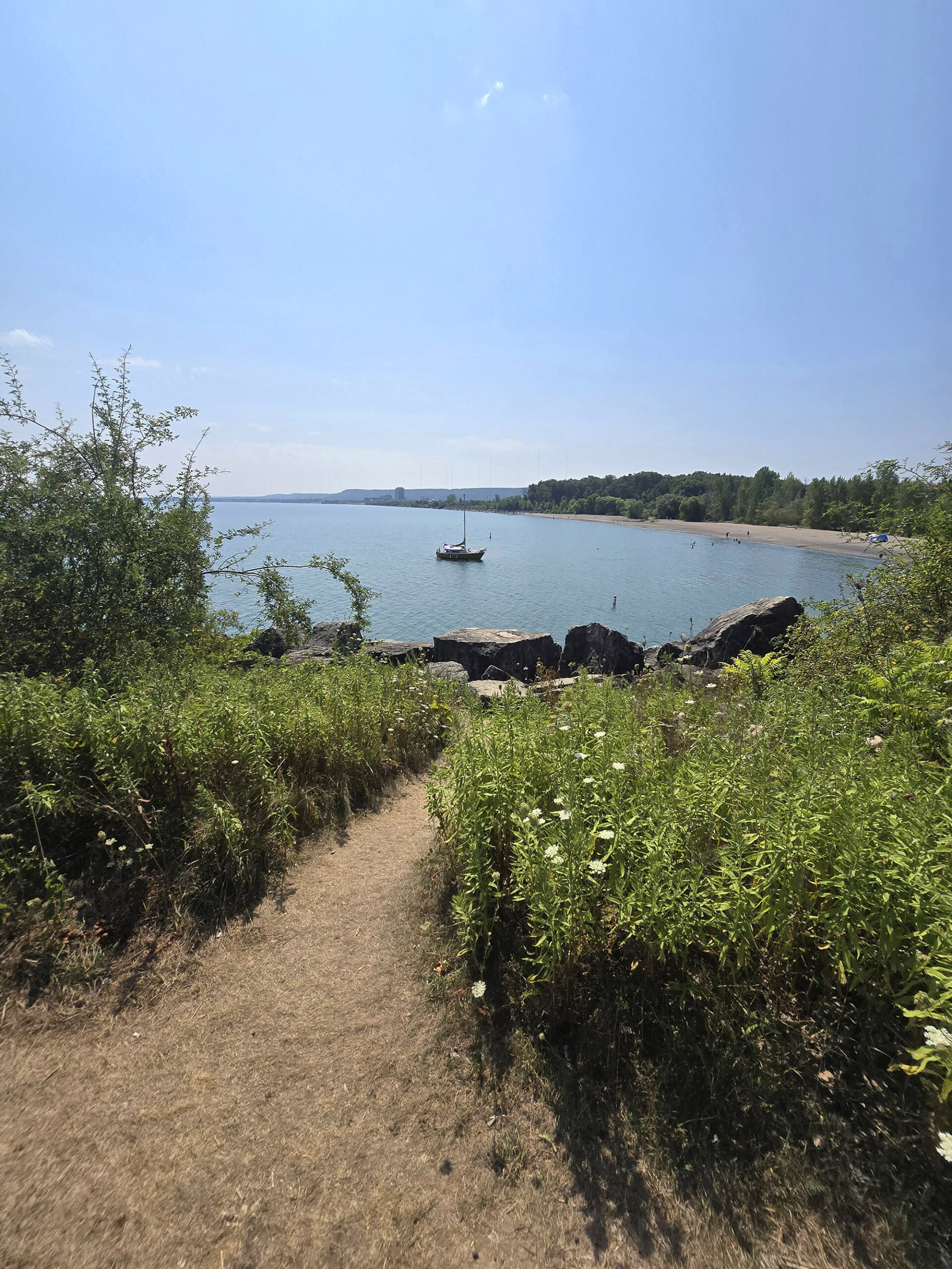 A view off a cliff to Lake Ontario and Fifty Point Beach, below.