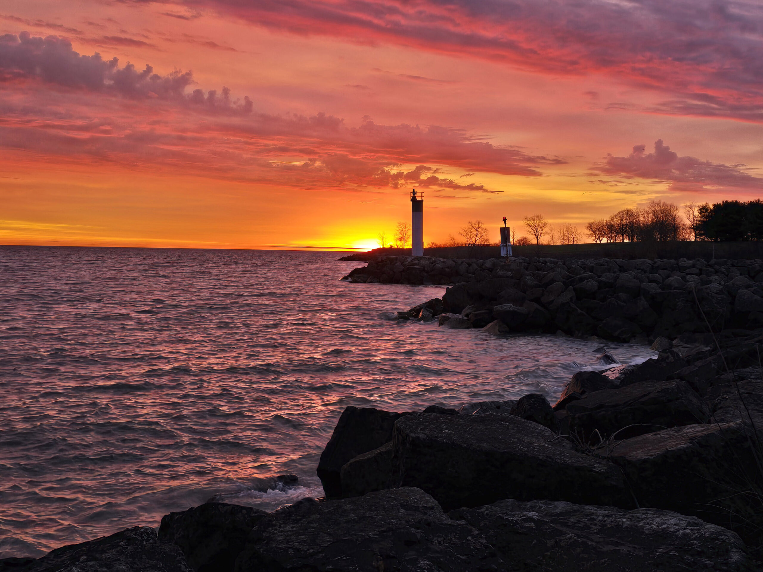 The shoreline of Fifty Point Conservation Area at sunrise.