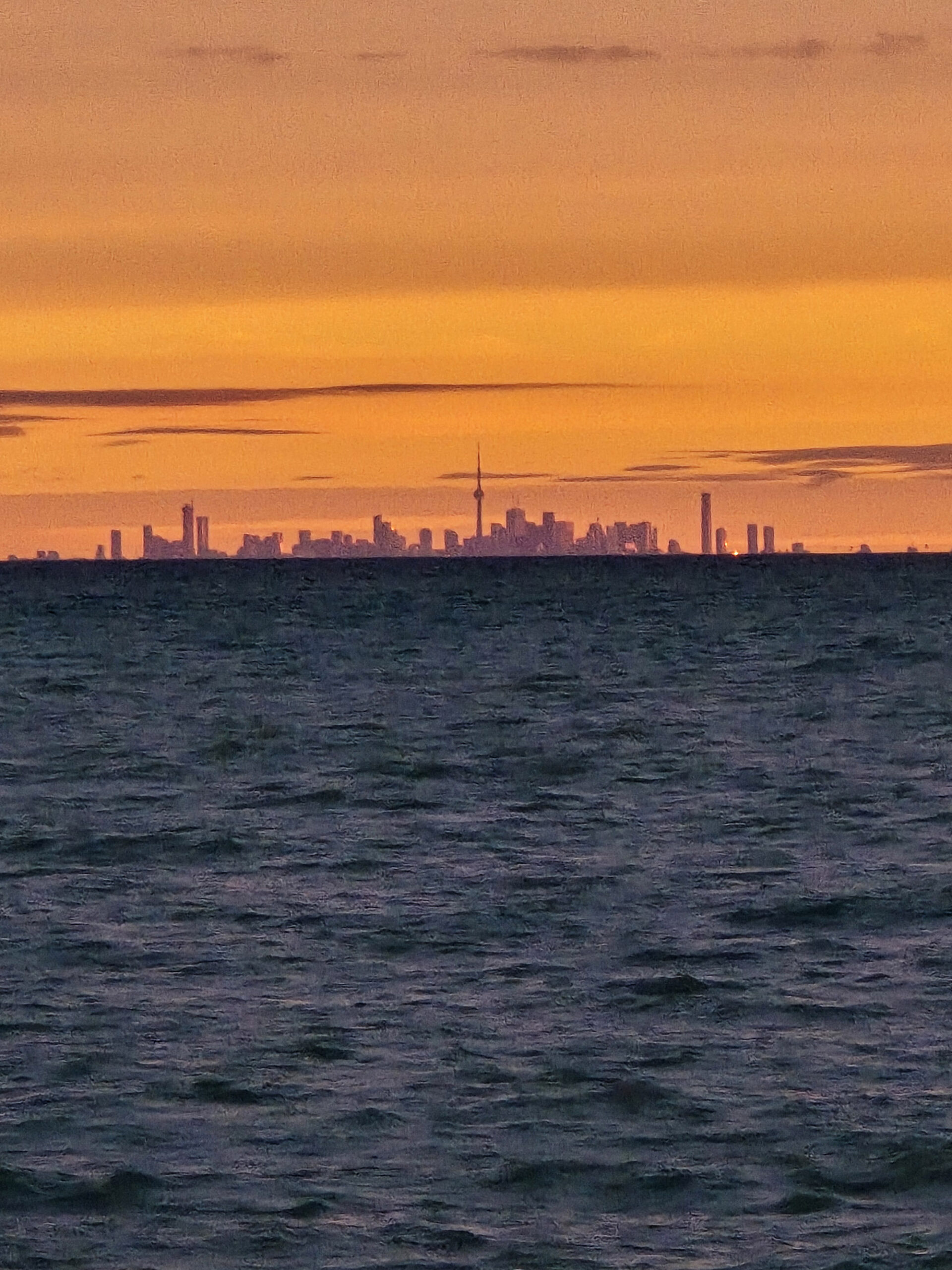 A view of Toronto from across Lake Ontario, at sunrise.