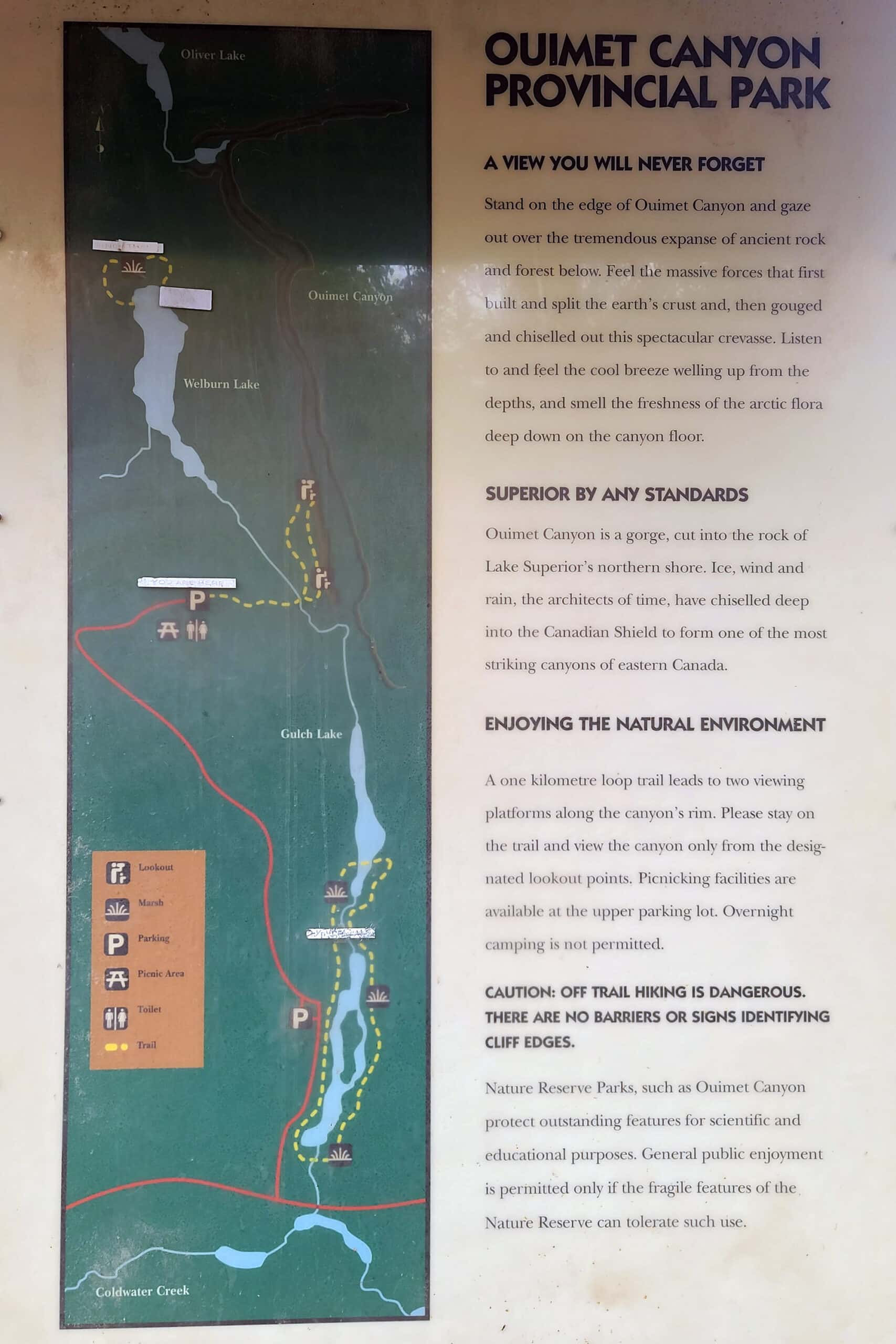 A sign with an alternate map of ouimet canyon provincial park.