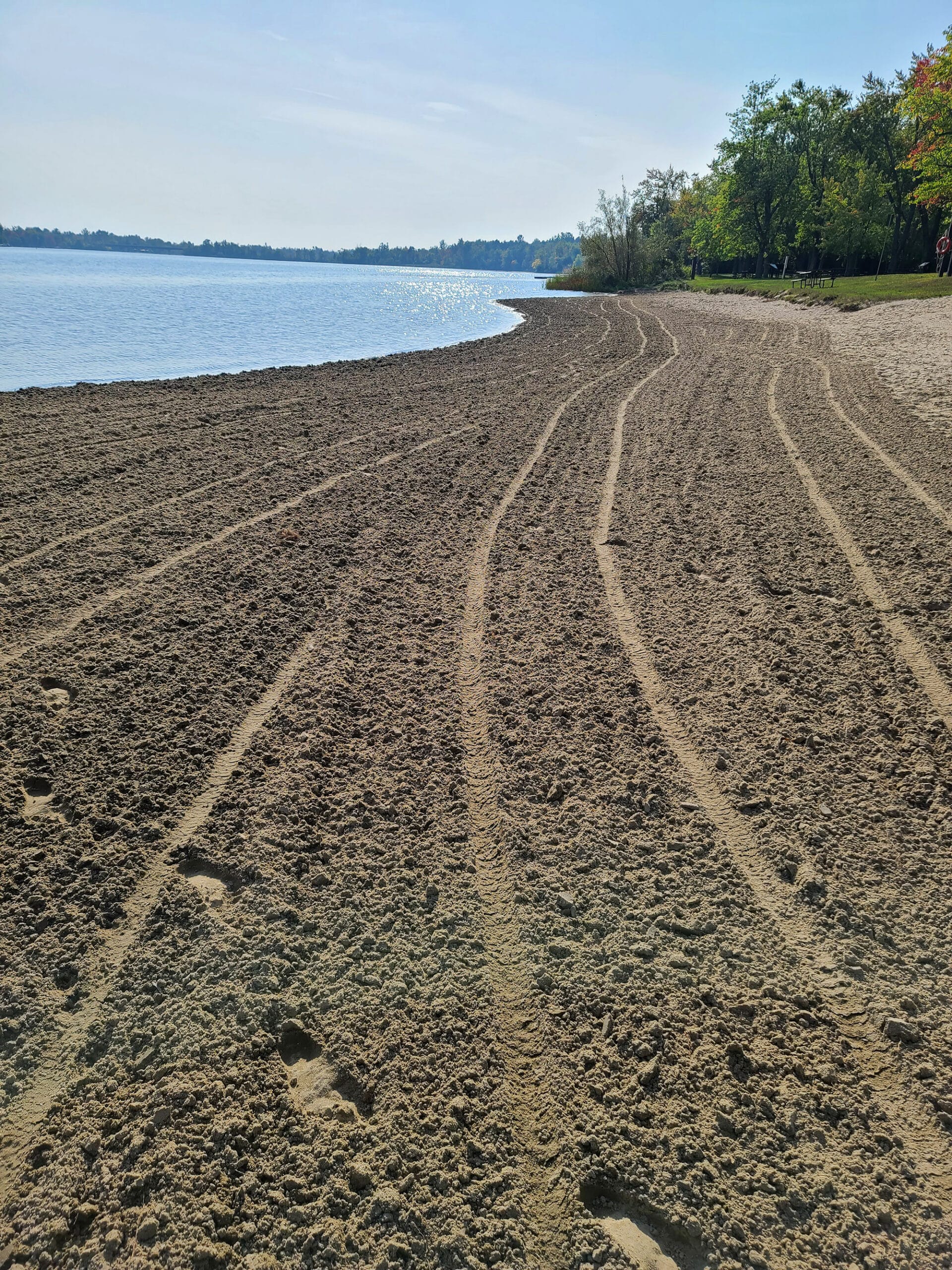 A large sand beach on the Rideau River.