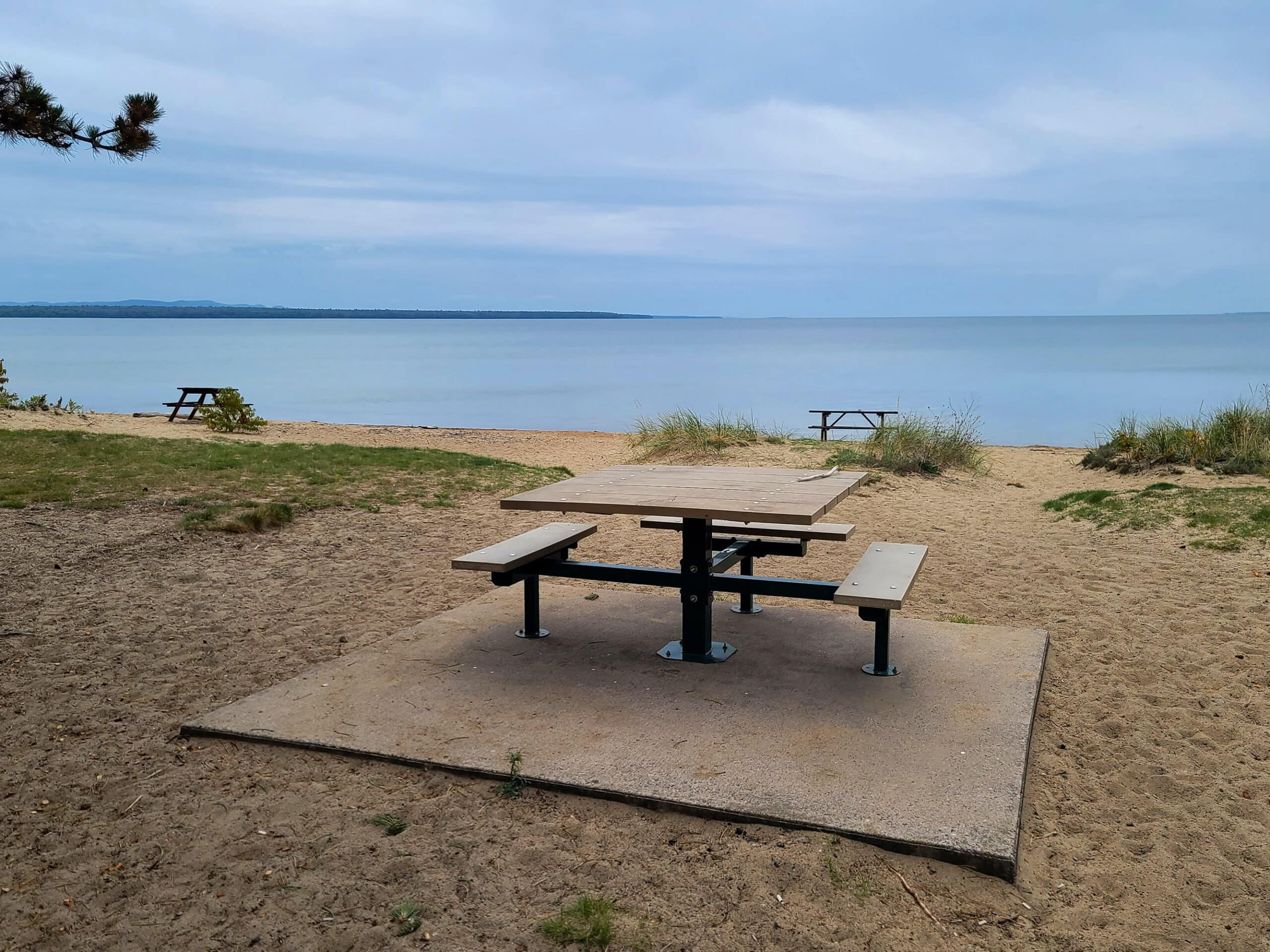 An accessible picnic table and platform.  It's on a beach, with no concrete pathway leading over the sand to get to it.