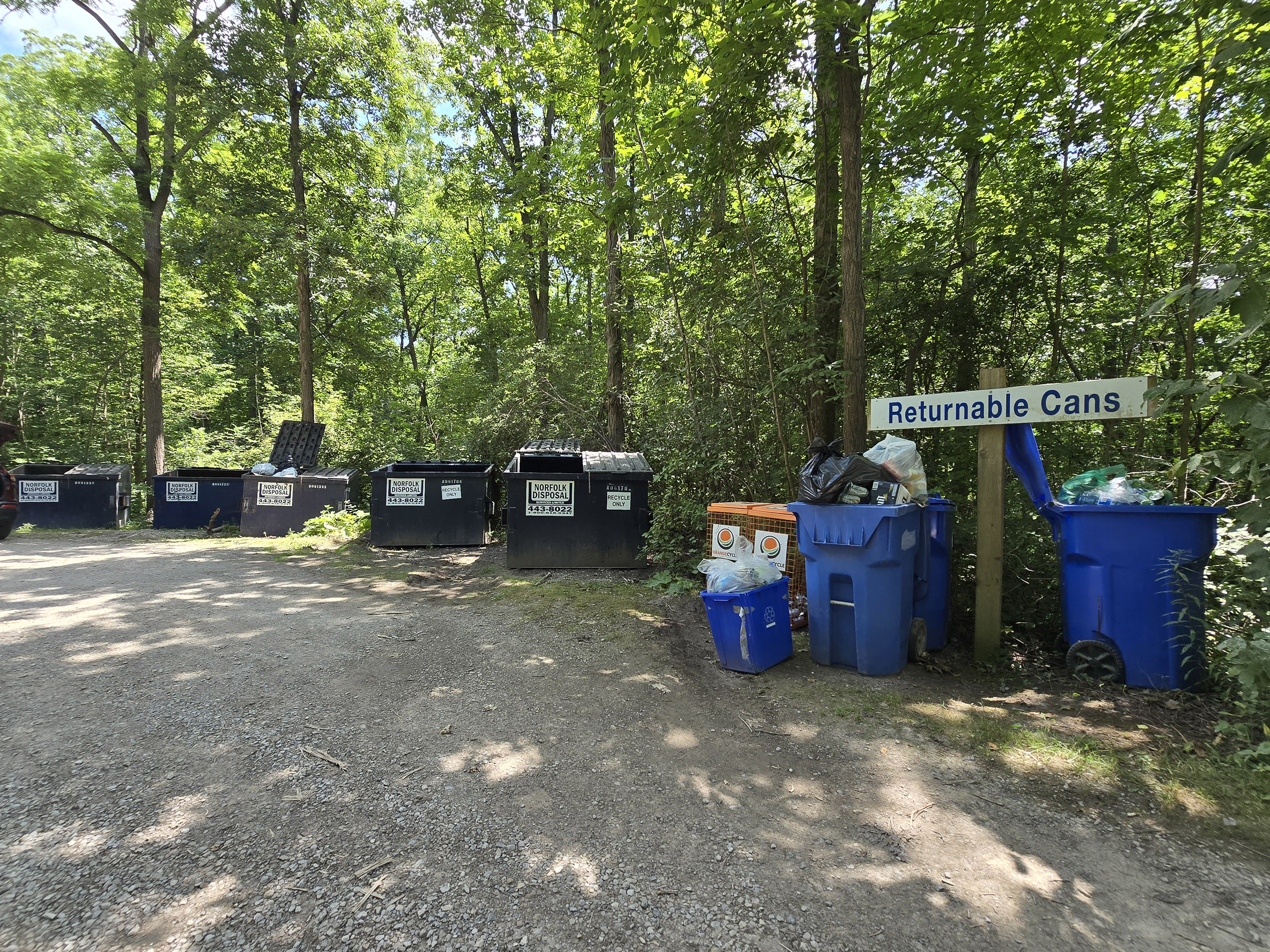 A garbage and recycling area.