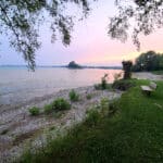 A rocky Lake Erie beach at sunset.