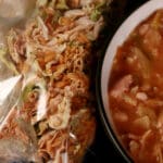 A bowl of cabbage roll soup, next to a packet of homemade instant soup mix.