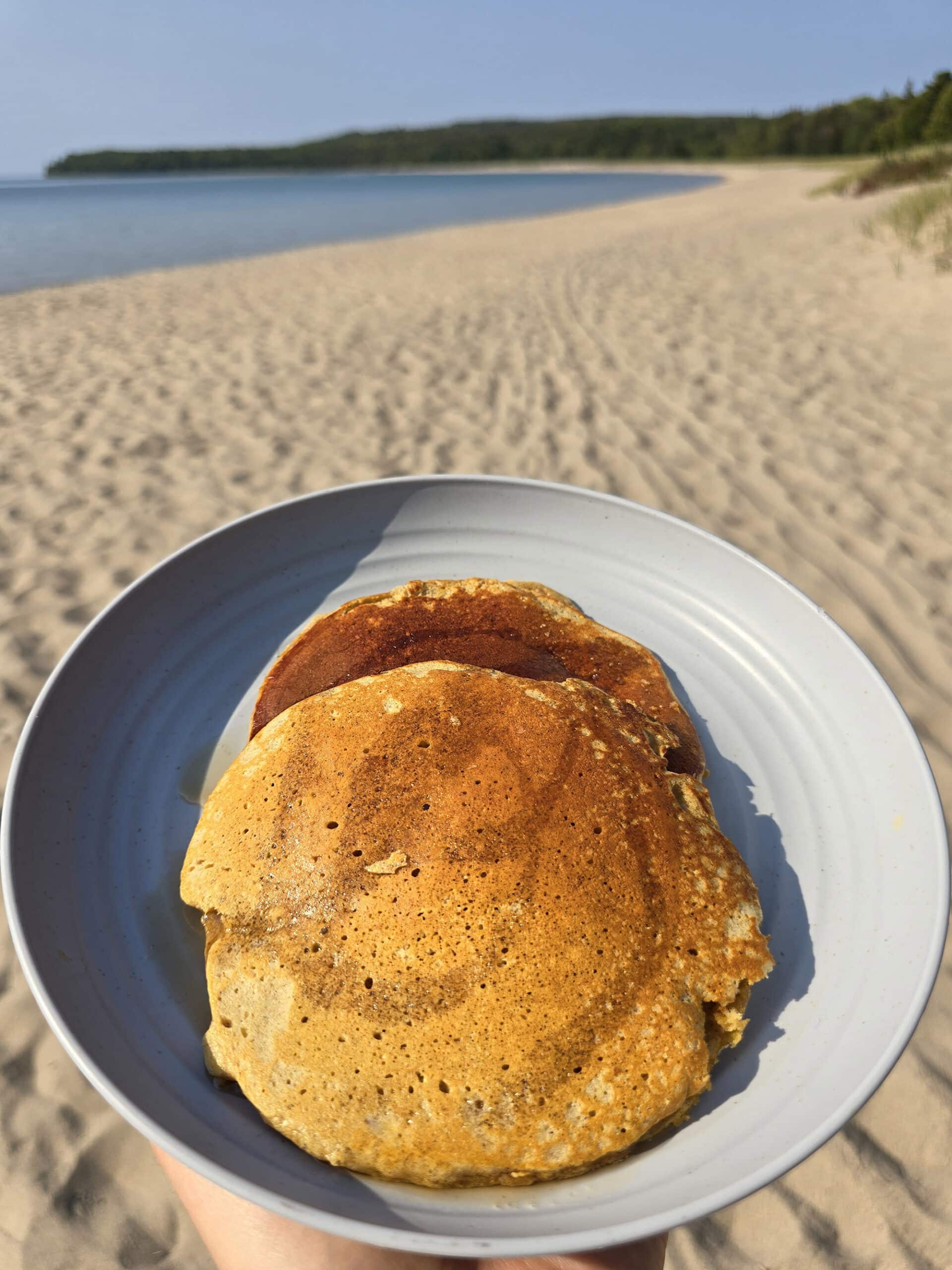 3 protein pumpkin pancakes on a camping plate.