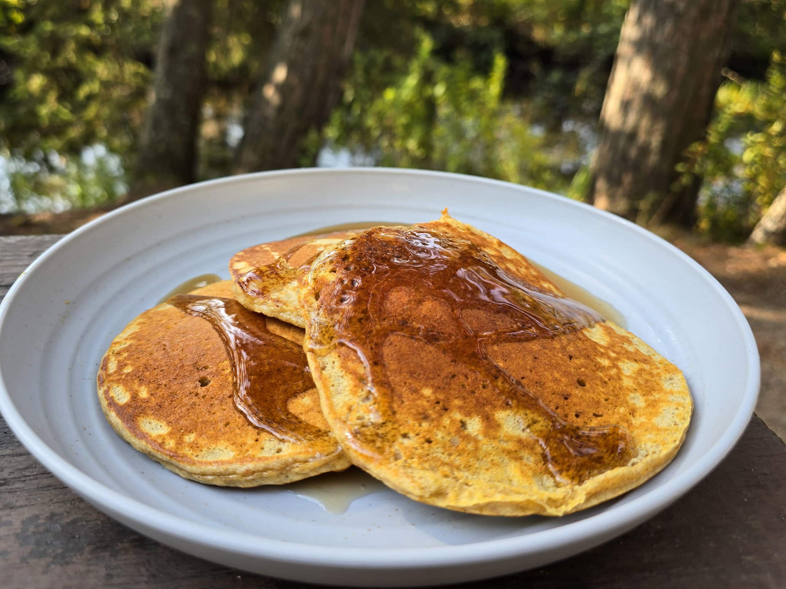 3 protein pumpkin pancakes on a camping plate.