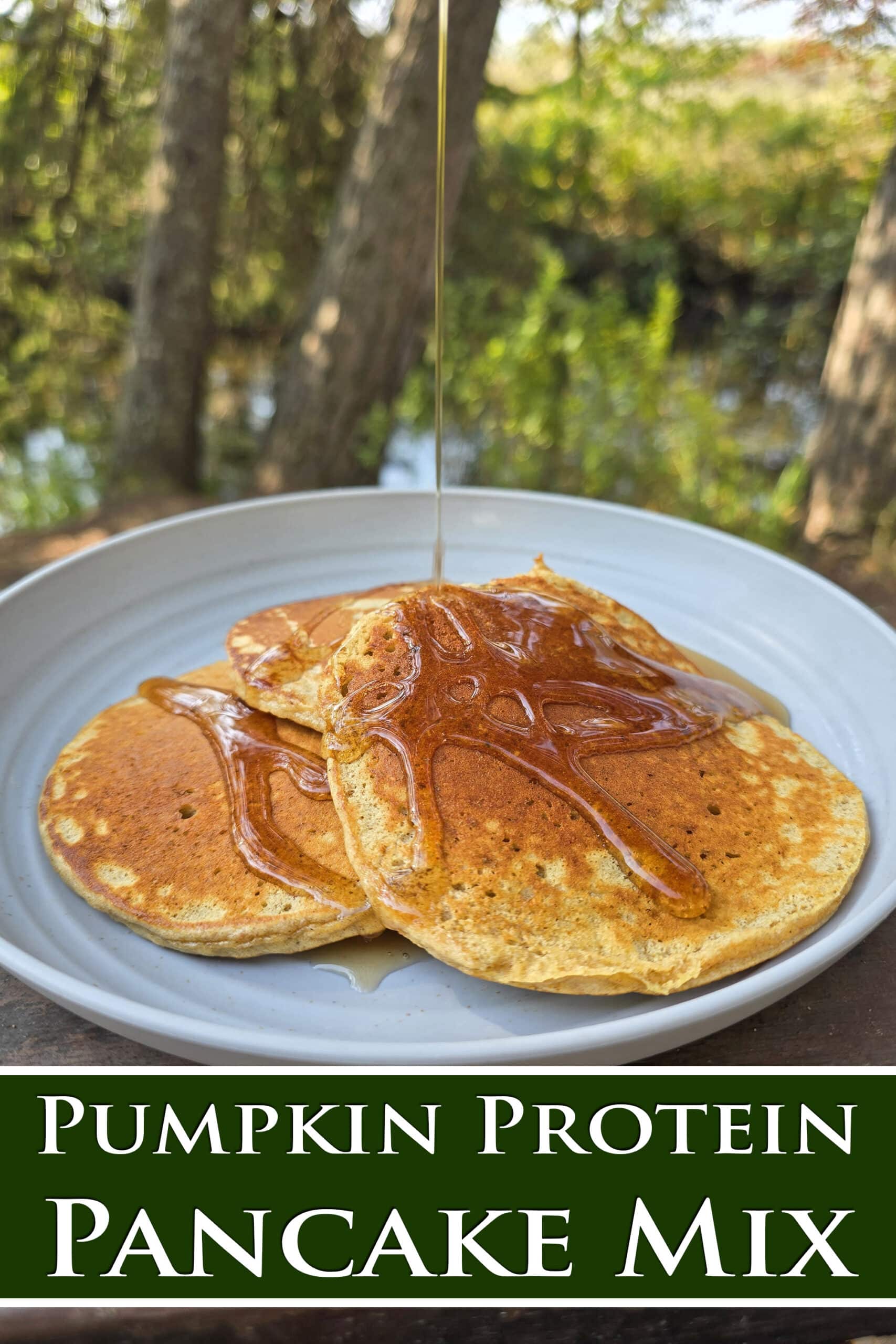 3 pumpkin pancakes on a camping plate. Overlaid text says pumpkin protein pancake mix.