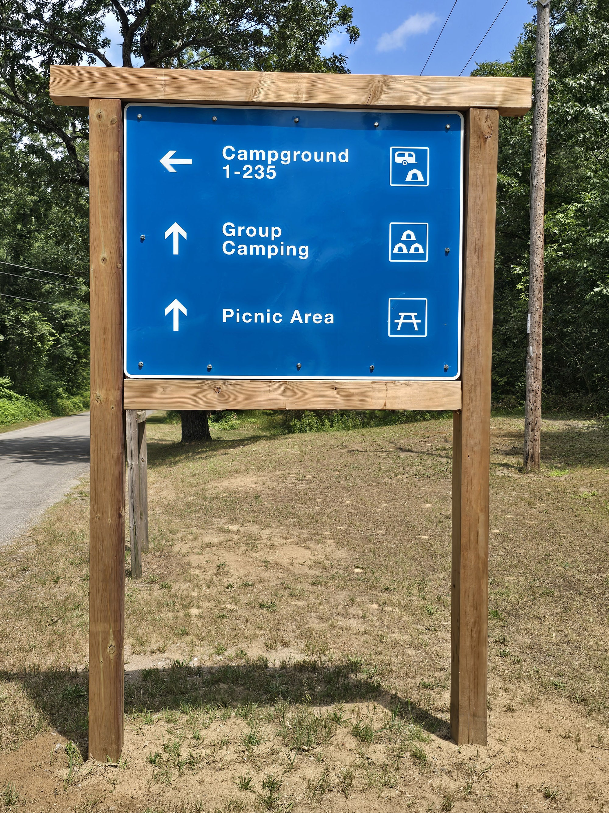 A large blue and white directional road sign.