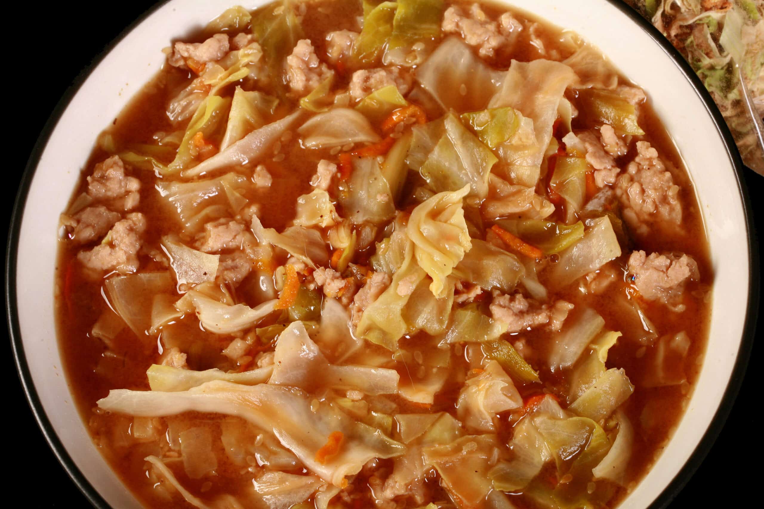 A bowl of egg roll soup made from a camping mix.