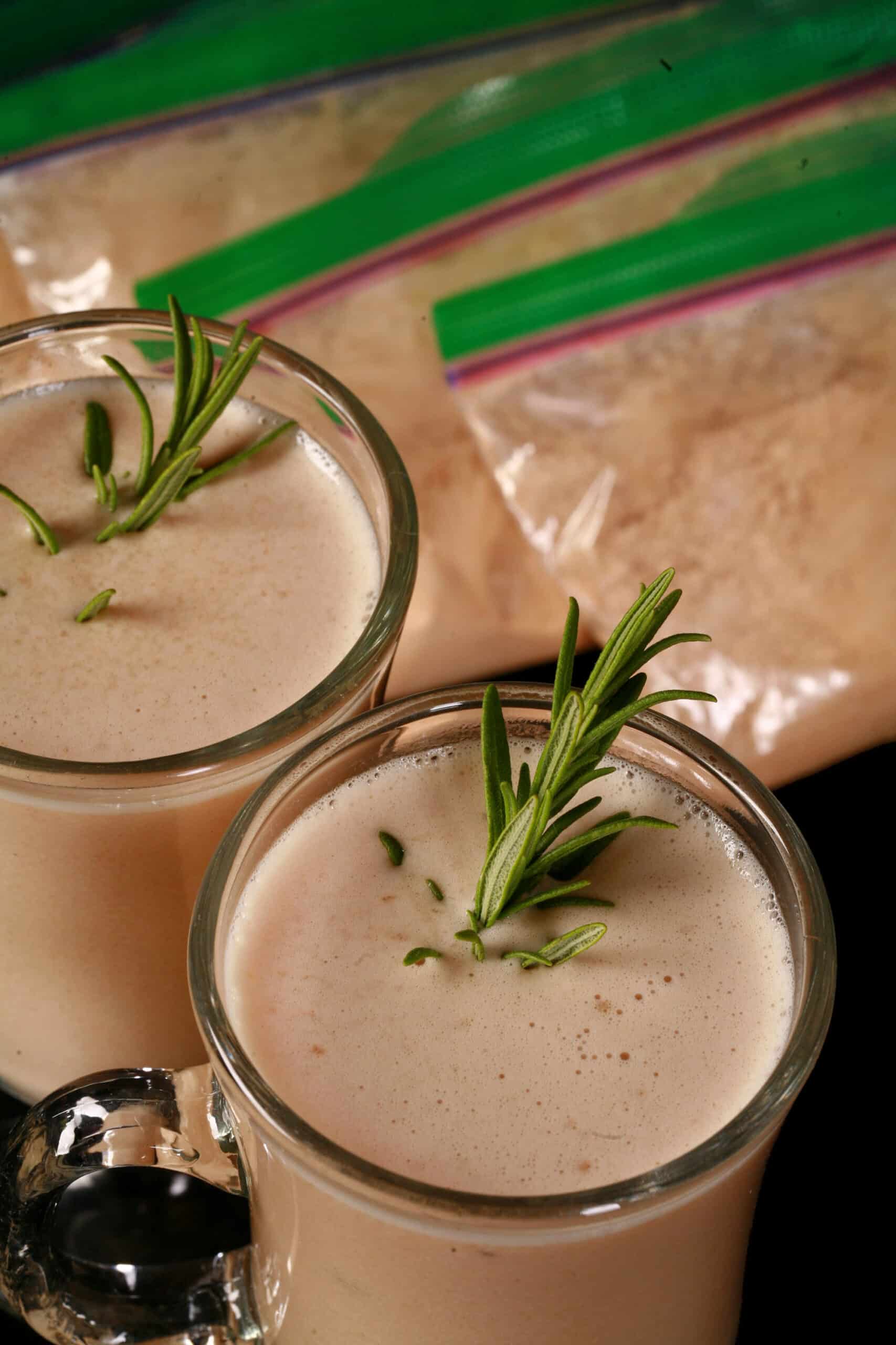 2 mugs of protein powder cream of chicken soup, with baggies of protein creamy chicken soup mix next to them.