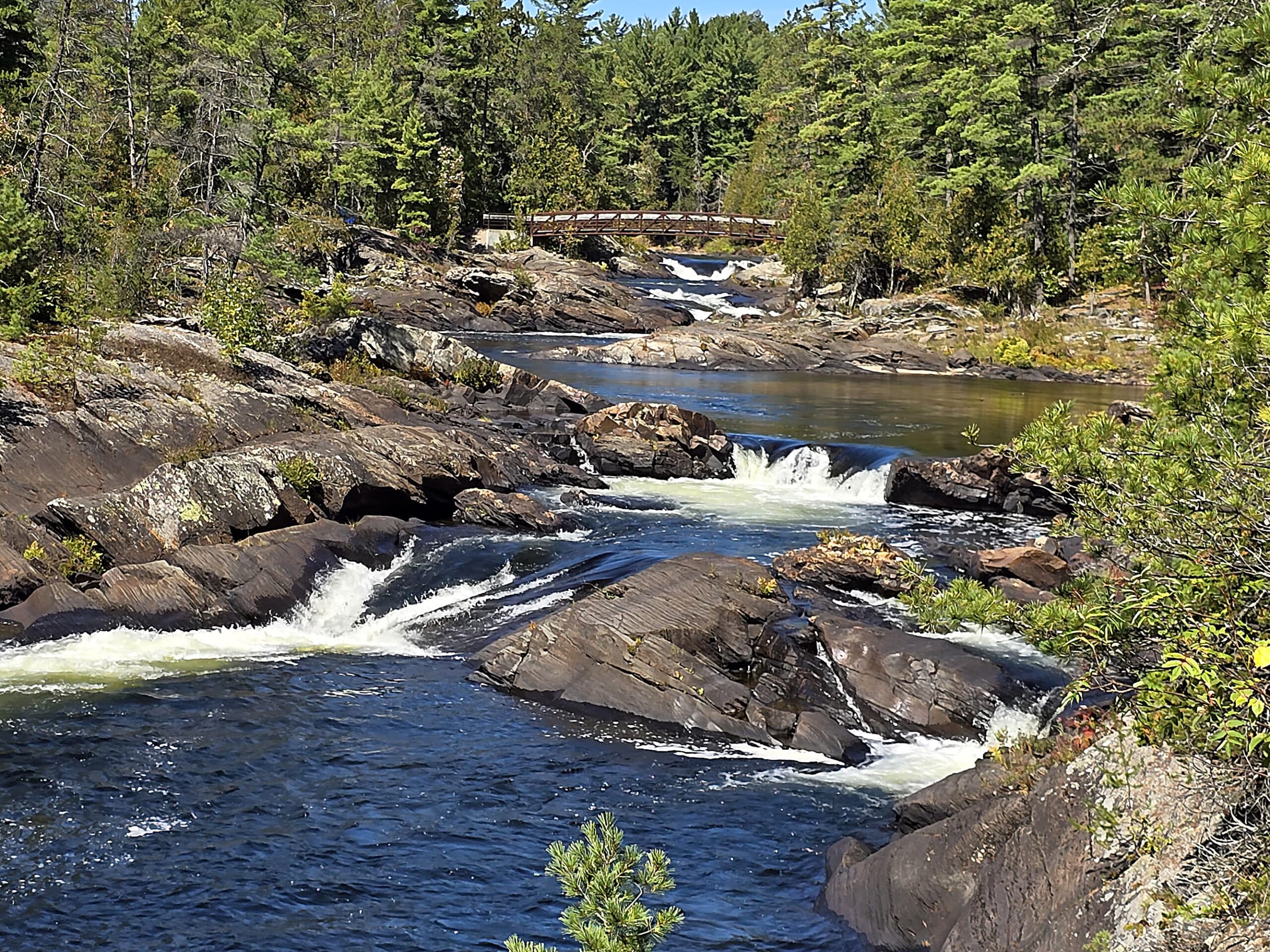 Falls and a bridge on the aux sables river.