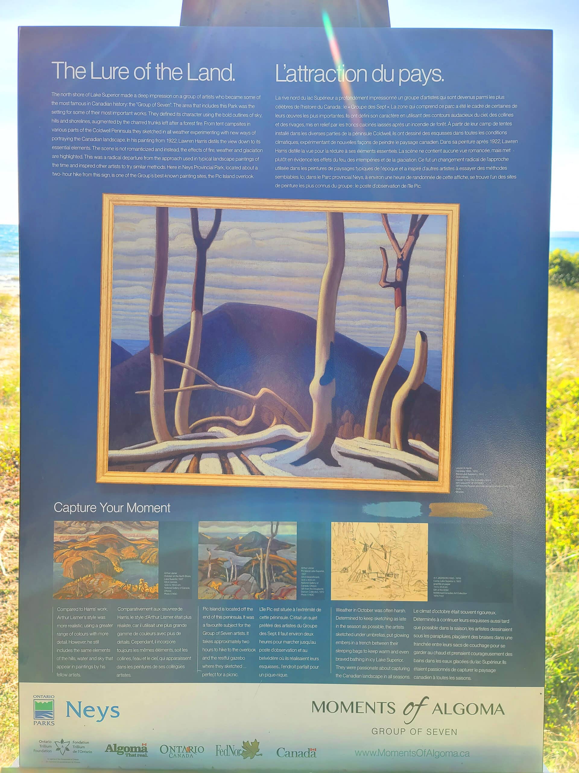 A photo of a Moments of Algoma billboard about the Group of 7's paintings of the area.