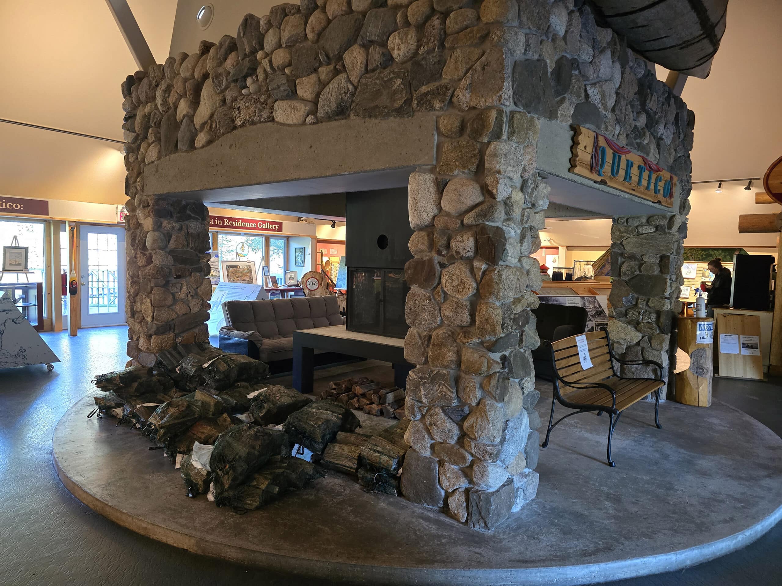 A large, open fireplace in the heritage pavilion entryway.