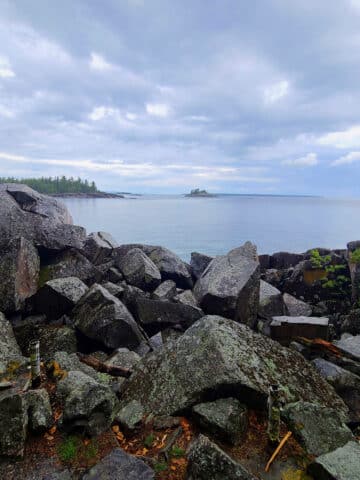 Lake Superior, with huge rocks in the foreground.