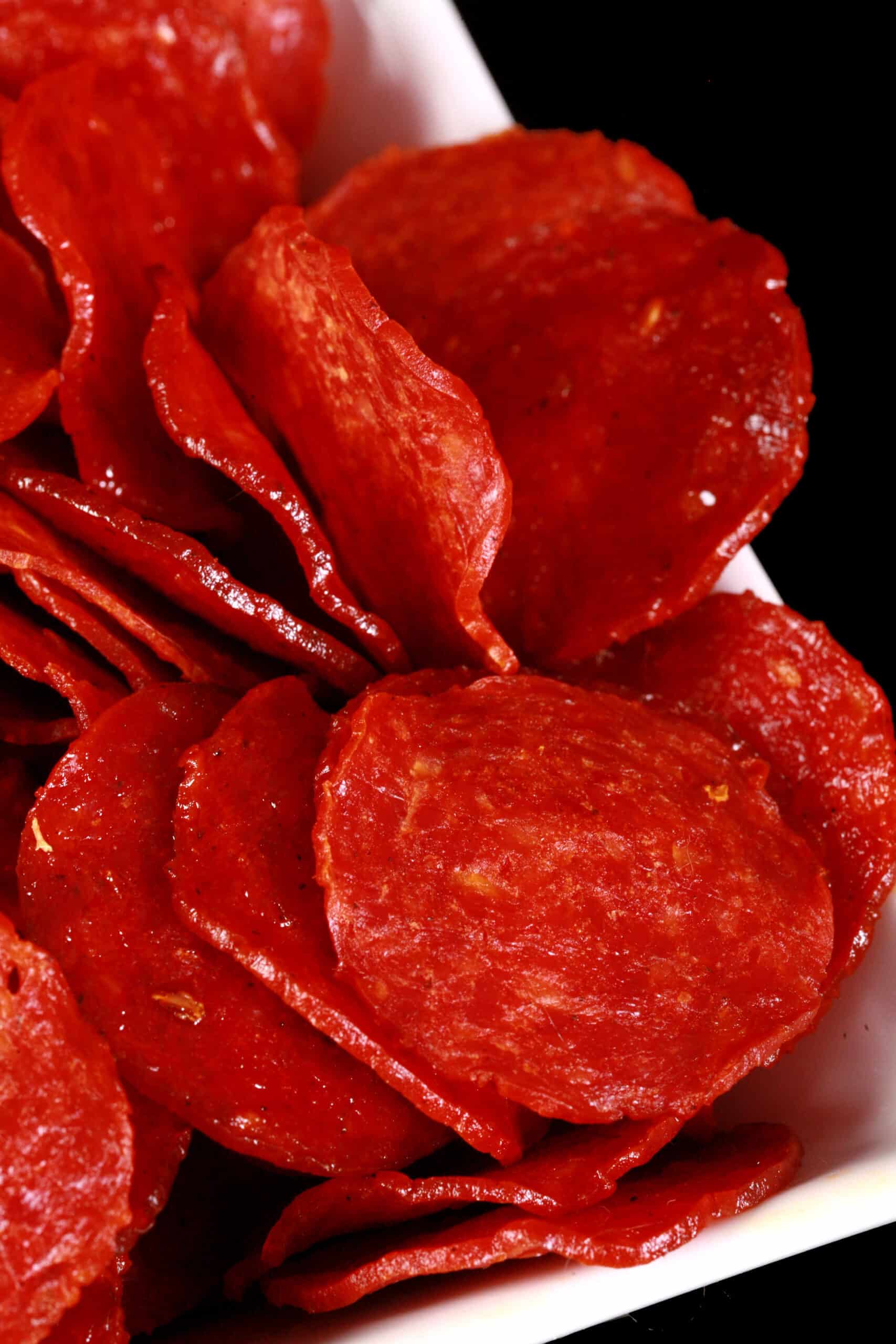 A bowl of pepperoni jerky slices.