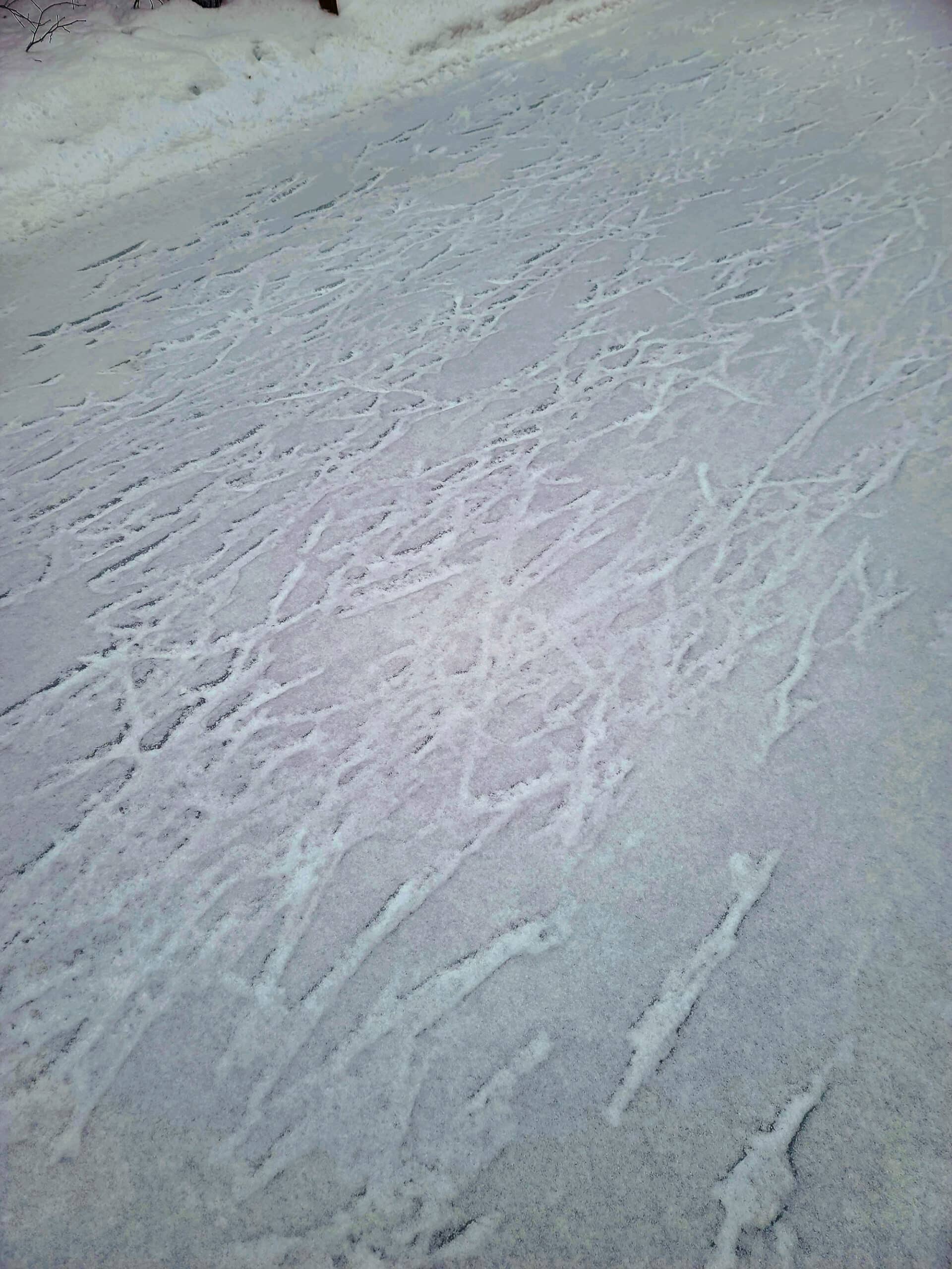 A close up view of a patch of very rough skating ice.