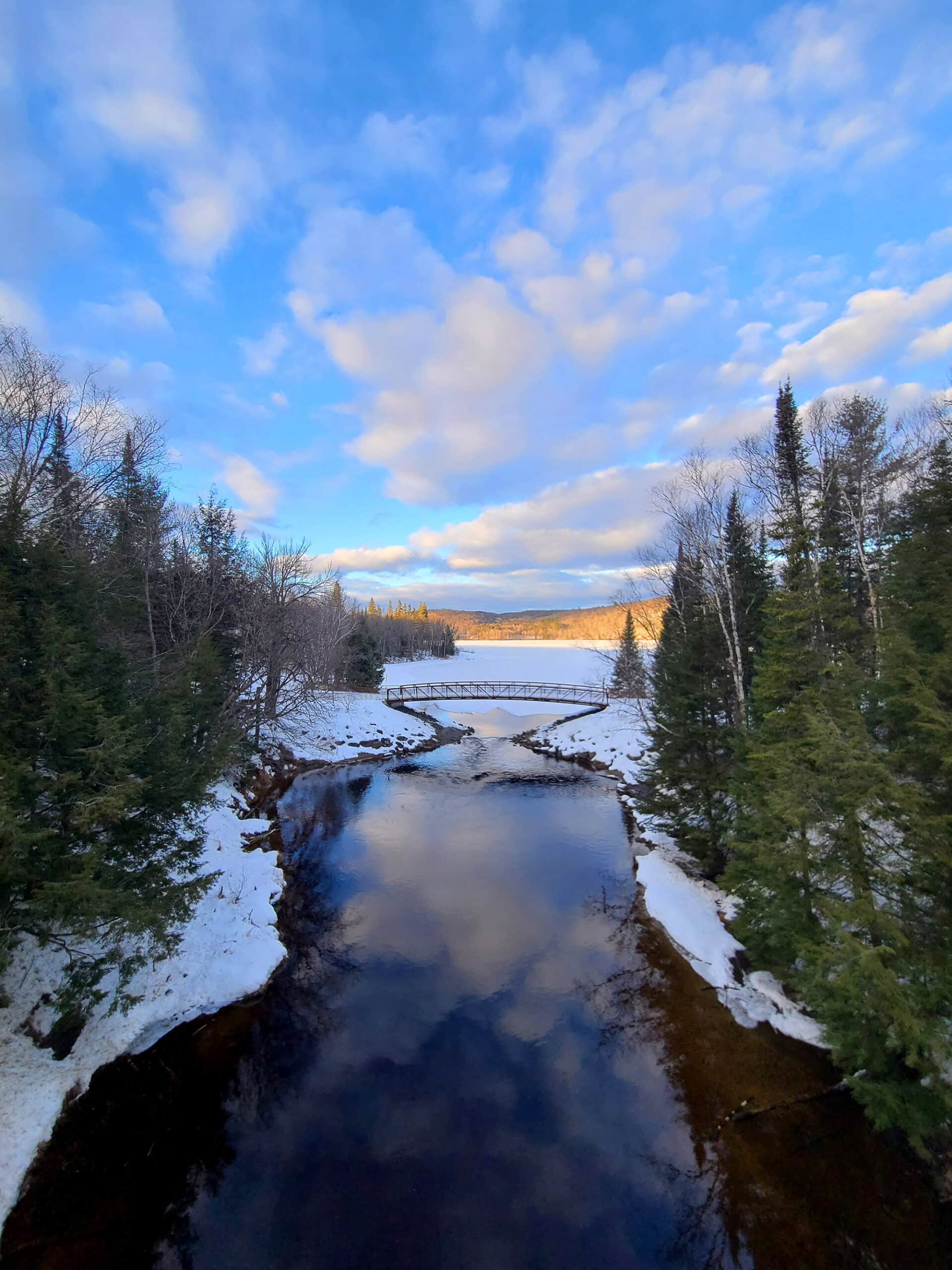 A stream and bridge at Arrowhead in winter.