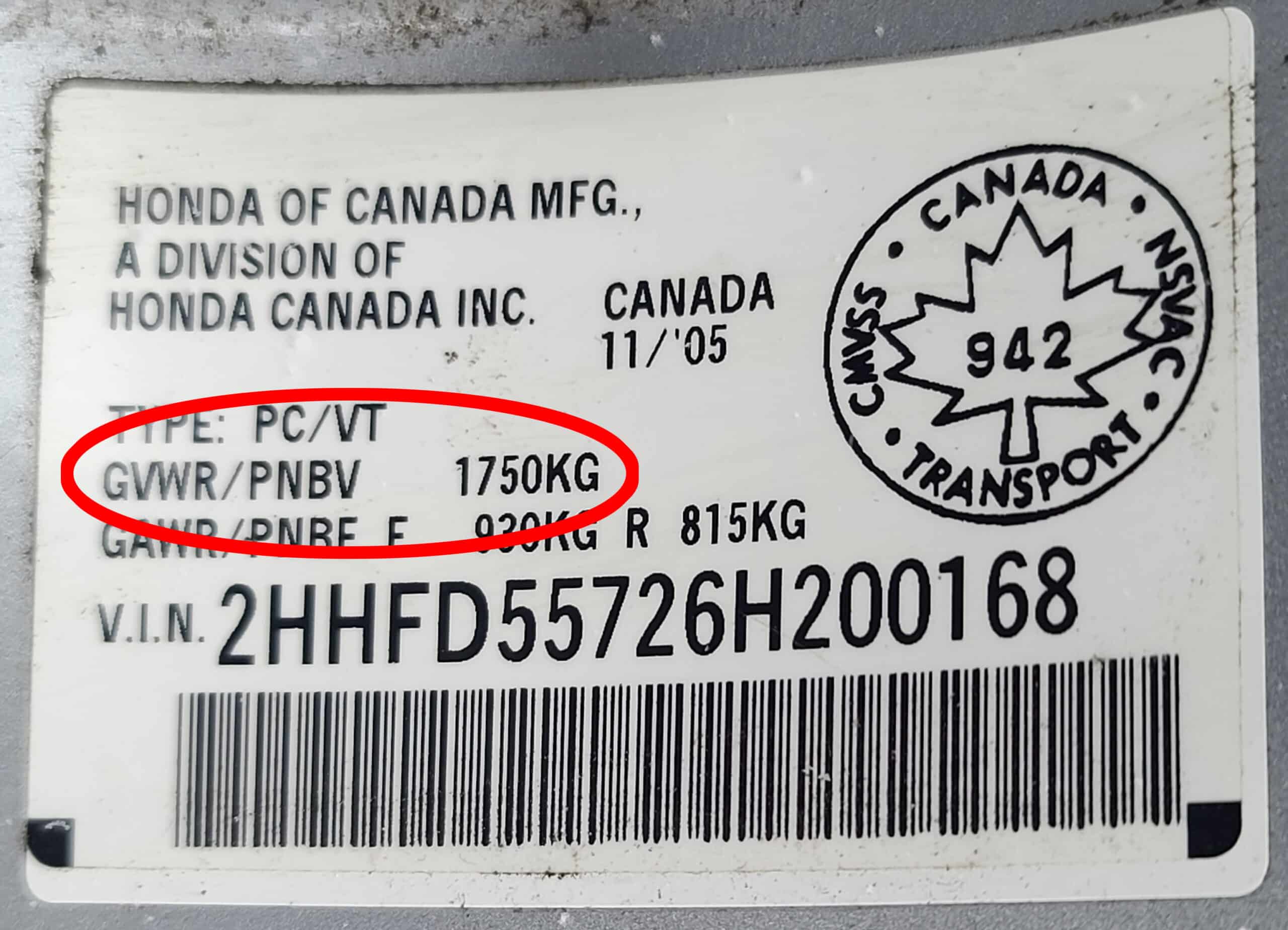 The Gross Vehicle Weight Rating (GVWR) tag from a car.  A red circle indicates this car's GVWR as 1750kg.