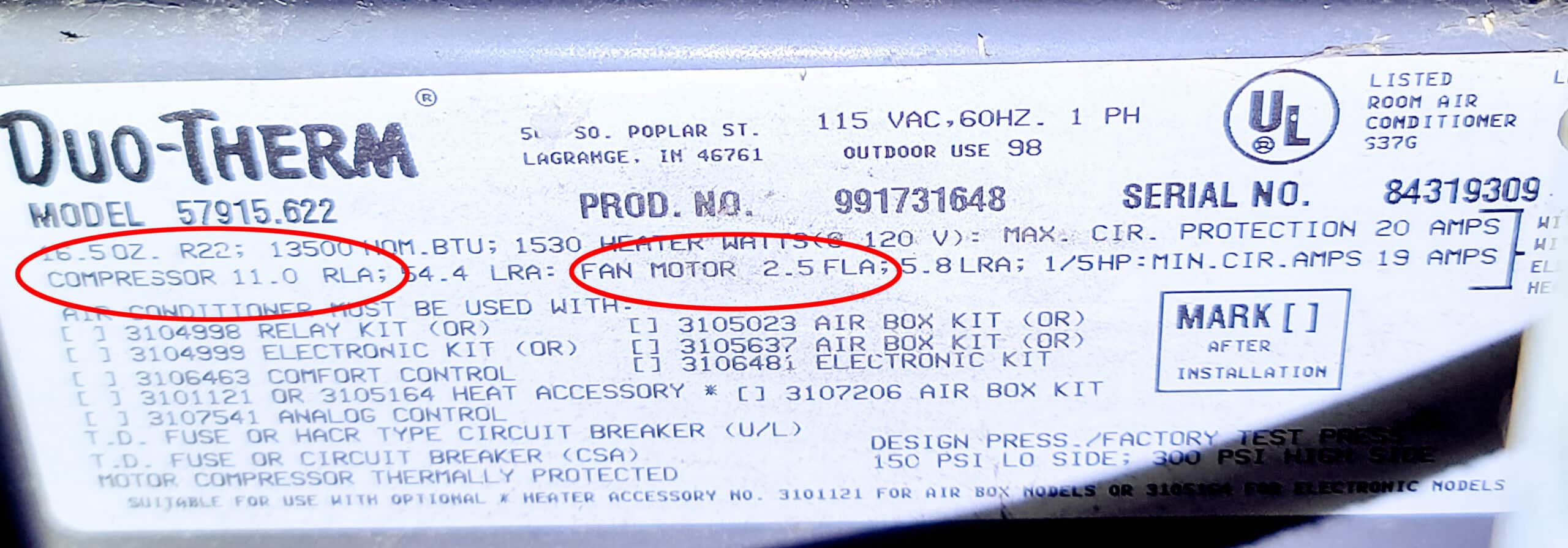 An electrical rating plate from an air conditioner, stating power requirements.