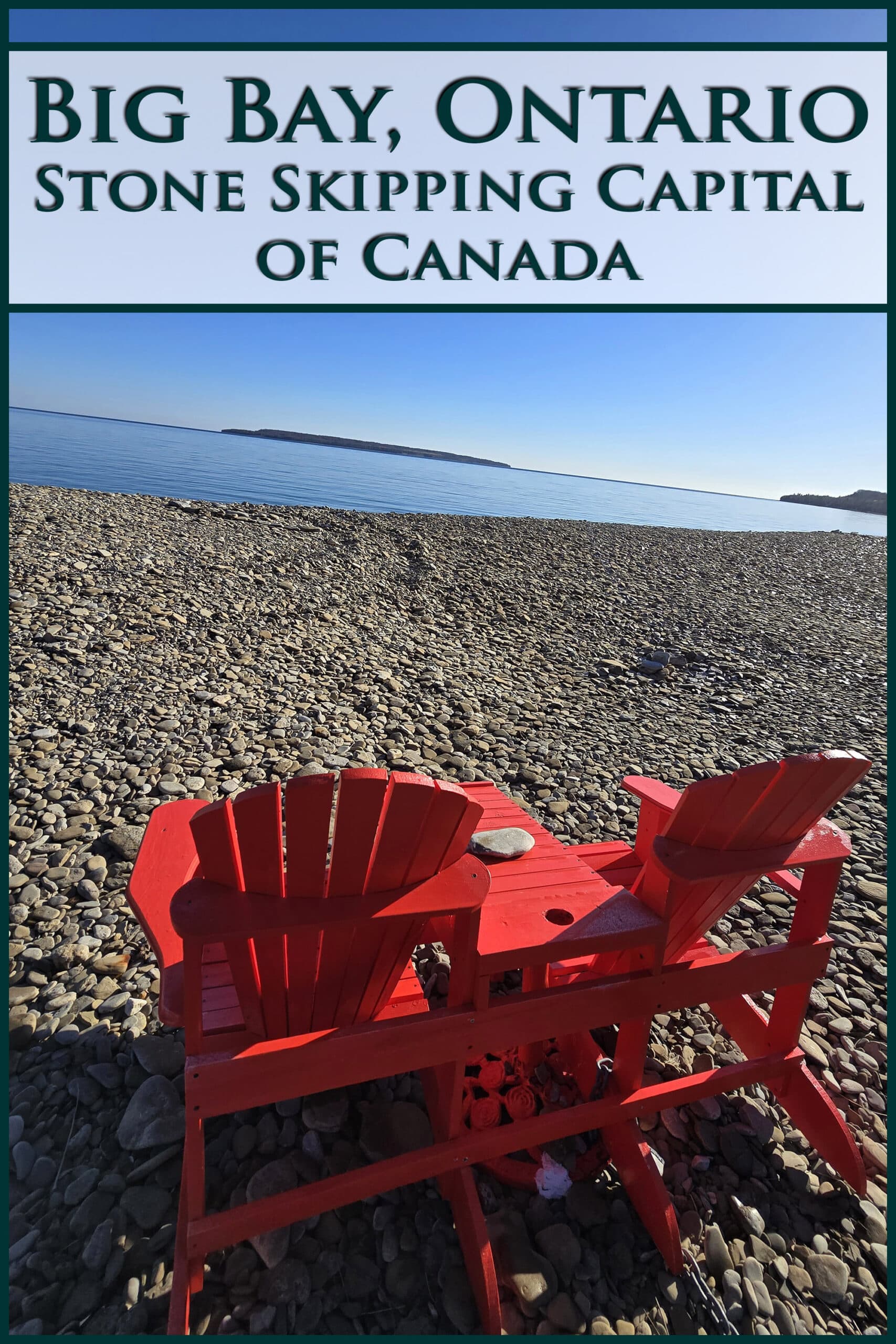 2 red Muskoka chairs overlooking the lake on a rocky beach. Overlaid text says Big Bay Ontario, stone skipping capital of Canada.