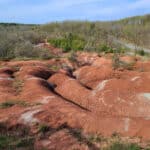 The cheltenham badlands - big ridges of red rock with pale green banding.