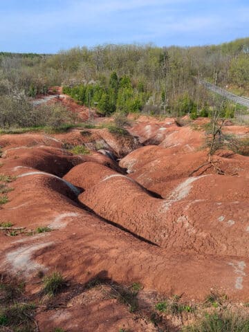 The cheltenham badlands - big ridges of red rock with pale green banding.