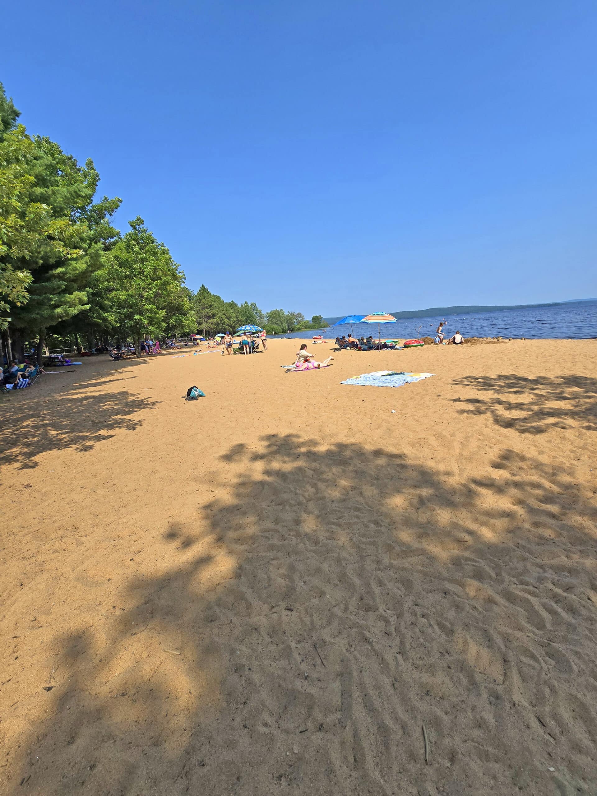 A long, sandy beach on Round Lake in Bonnechere Provincial Park.