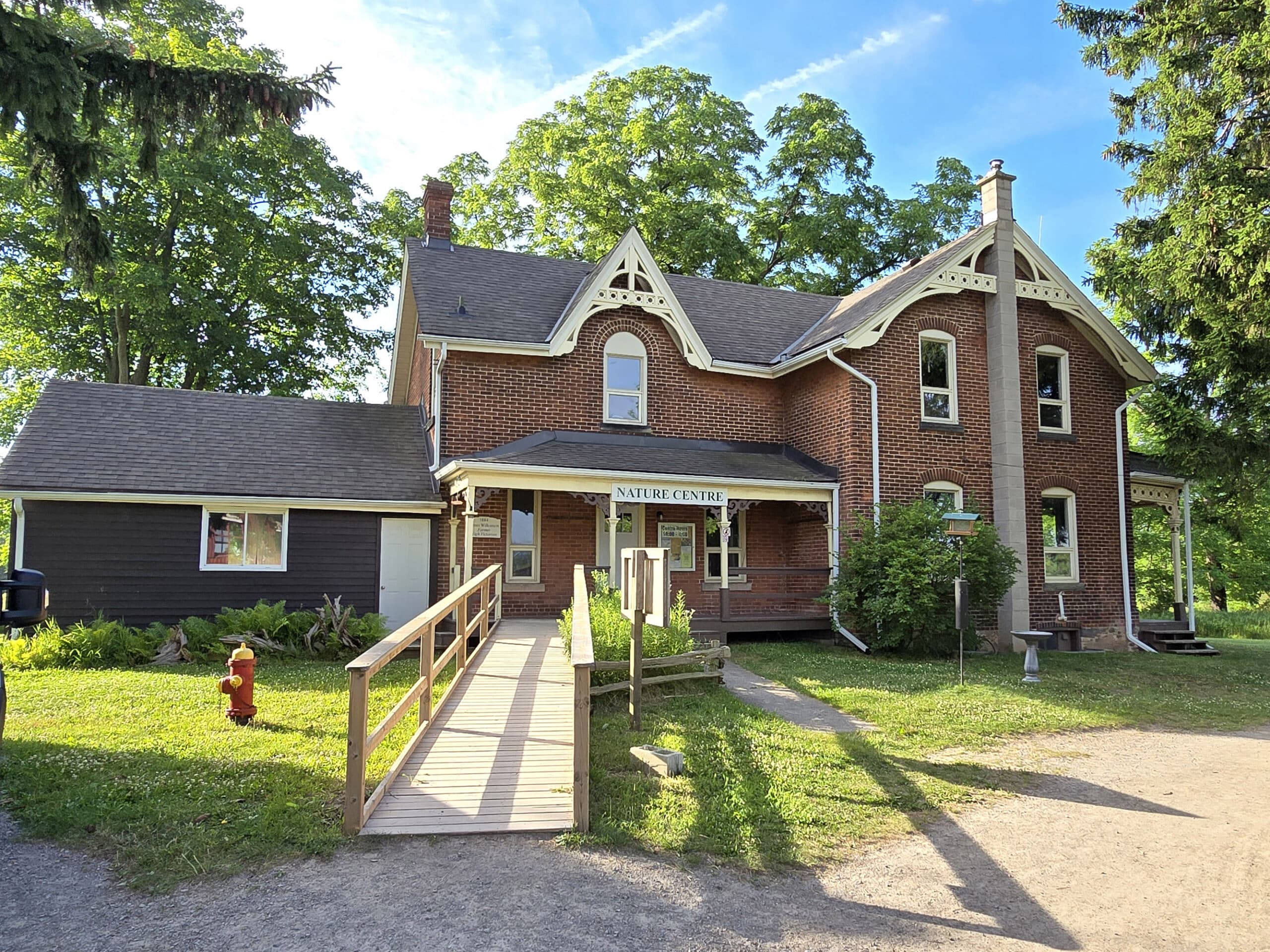 A Victorian Style building with Nature Centre sign on it.