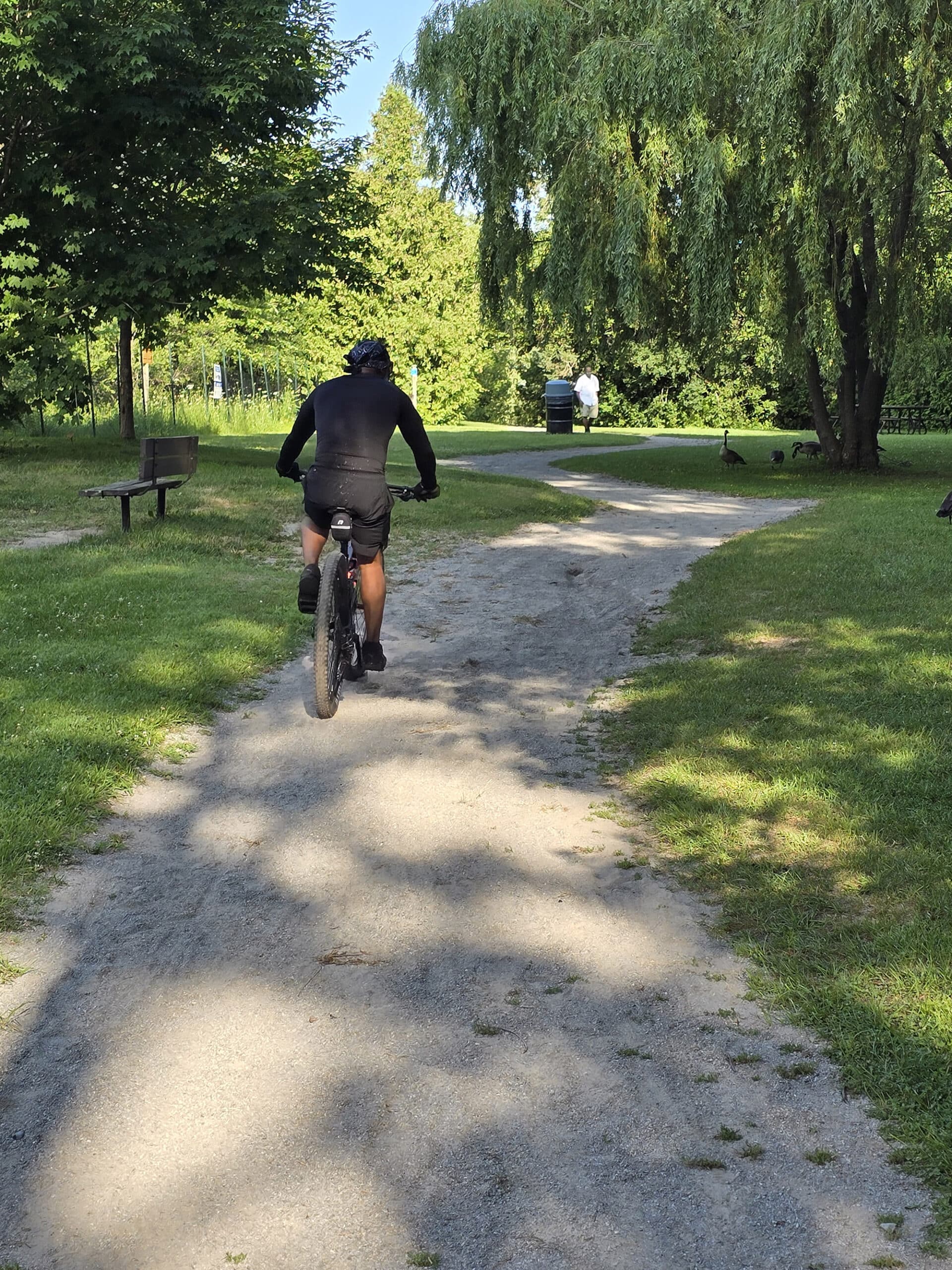 A man cycling through Darlington provincial park.