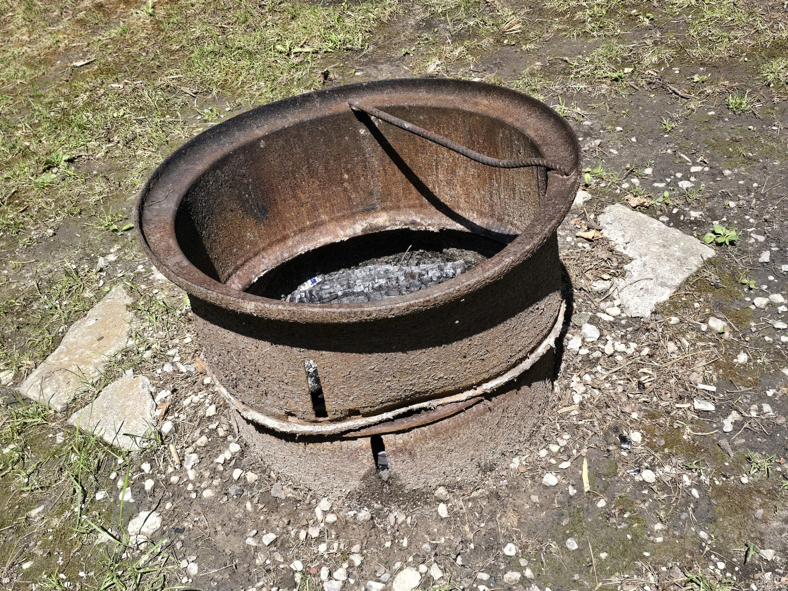 A weird rusted metal bucket thing for a fire ring.