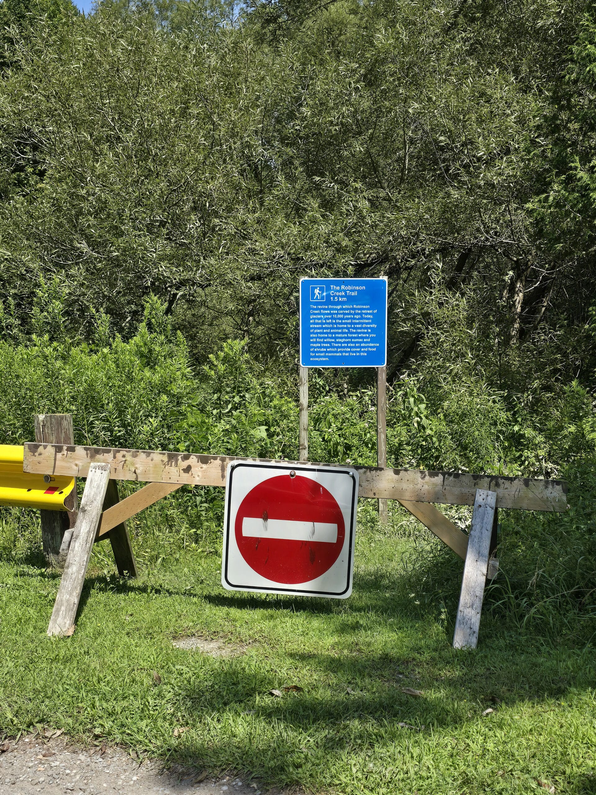 Robinson Creek Trail entrance, blocked with a barricade.