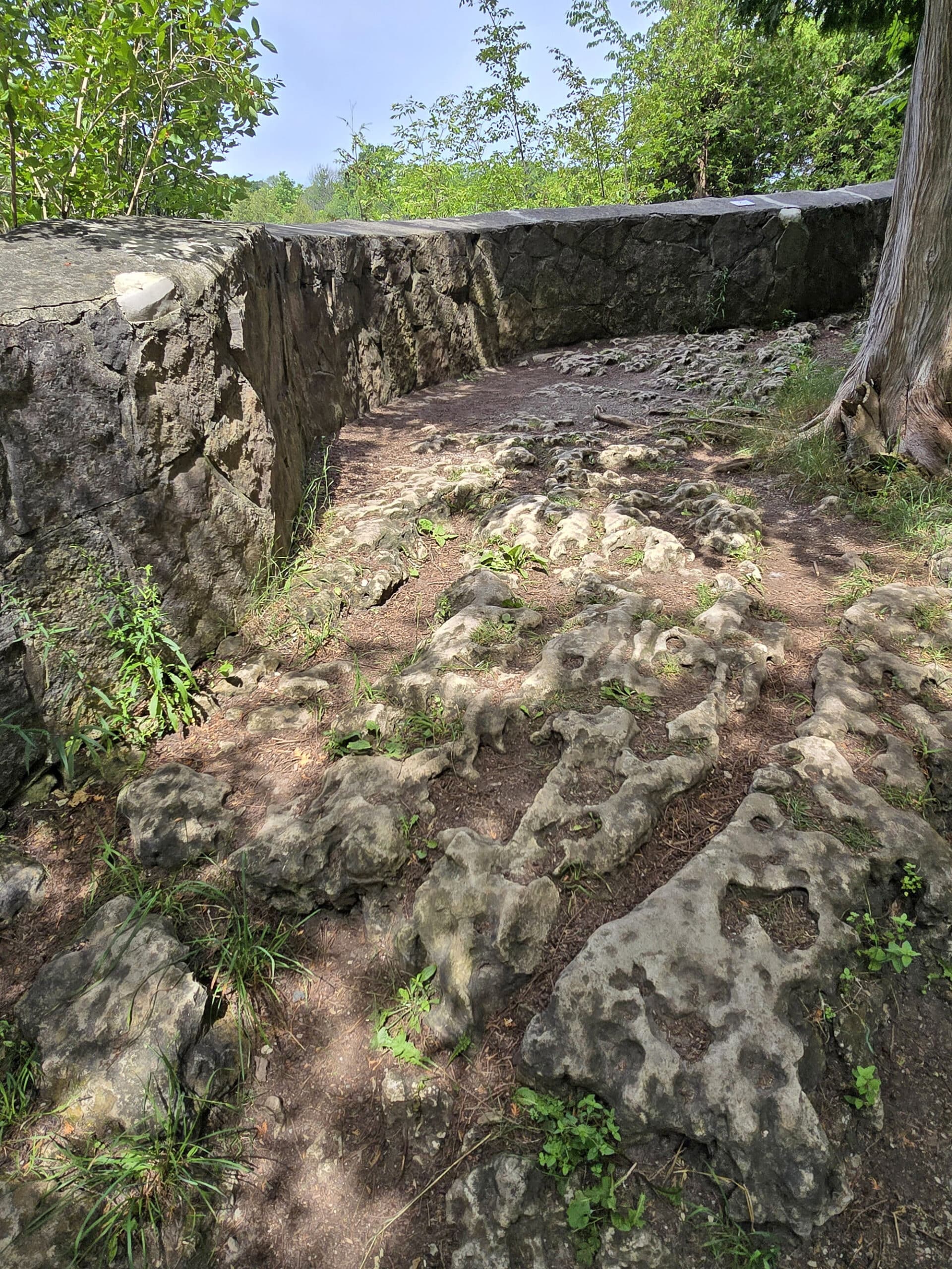 A stone viewing platform with rough base.