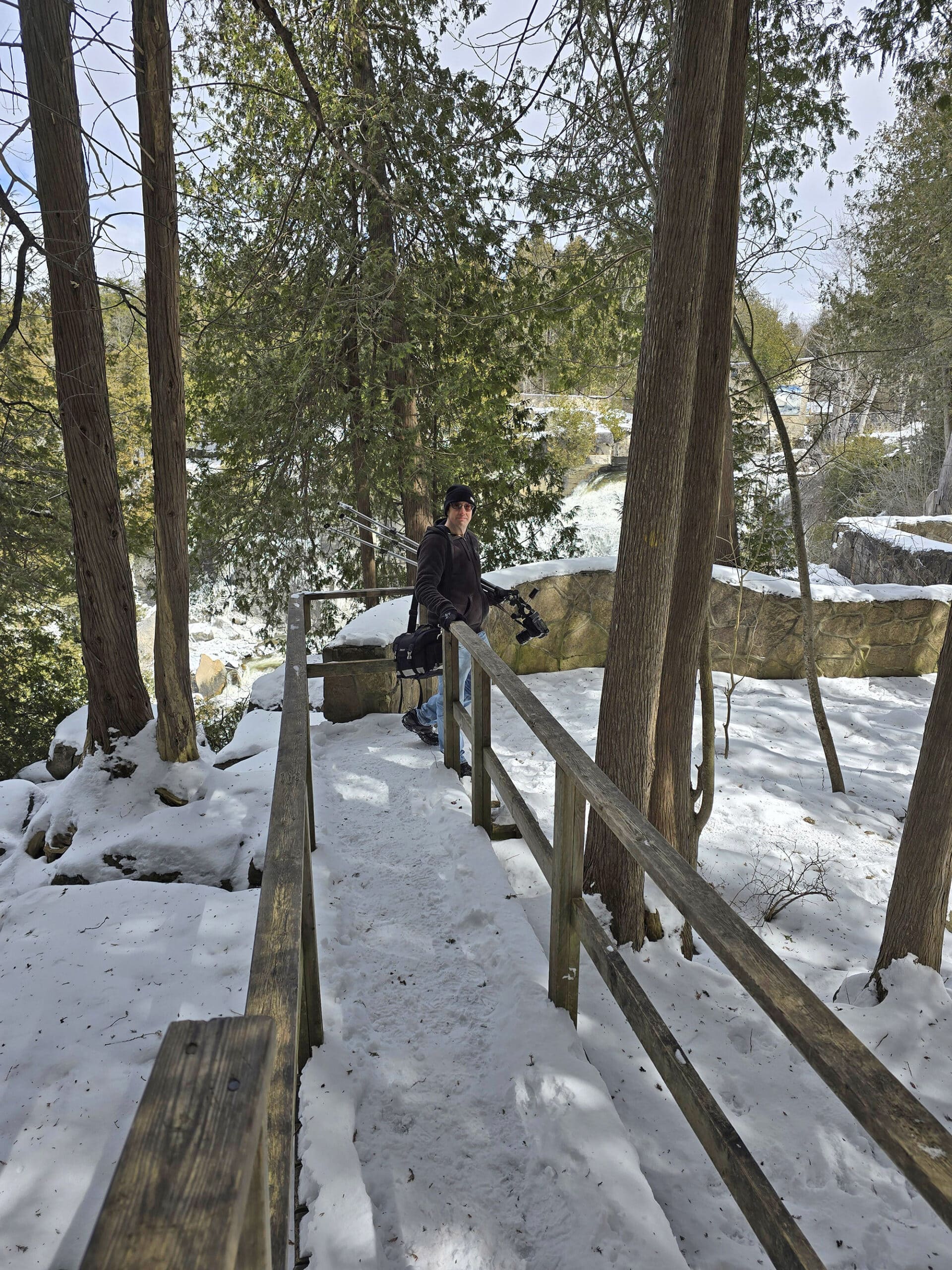 A man walking the Bruce Trail at Inglis Falls Conservation Area in winter.