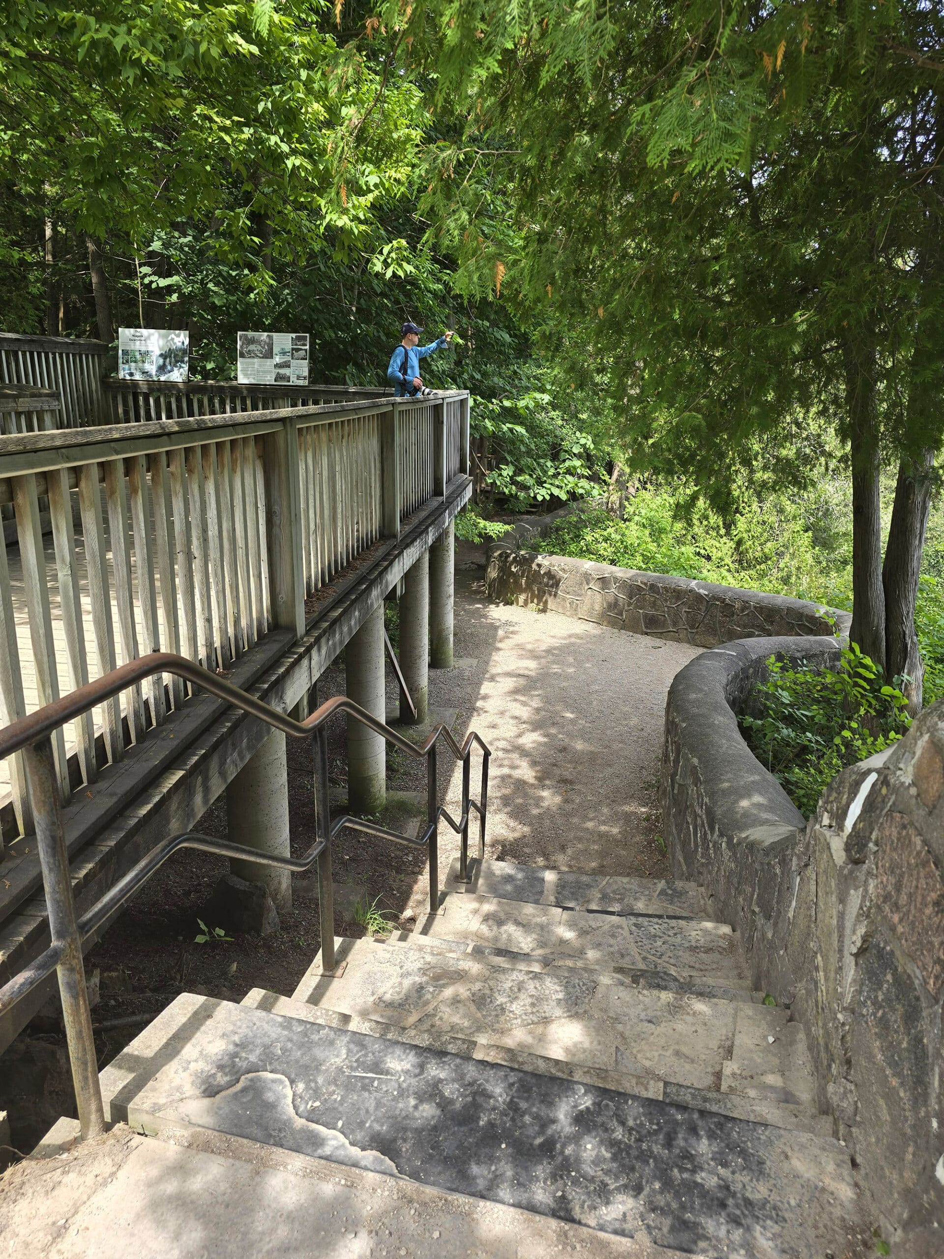 A stone outlook and wooden viewing platform overlooking Inglis Falls.