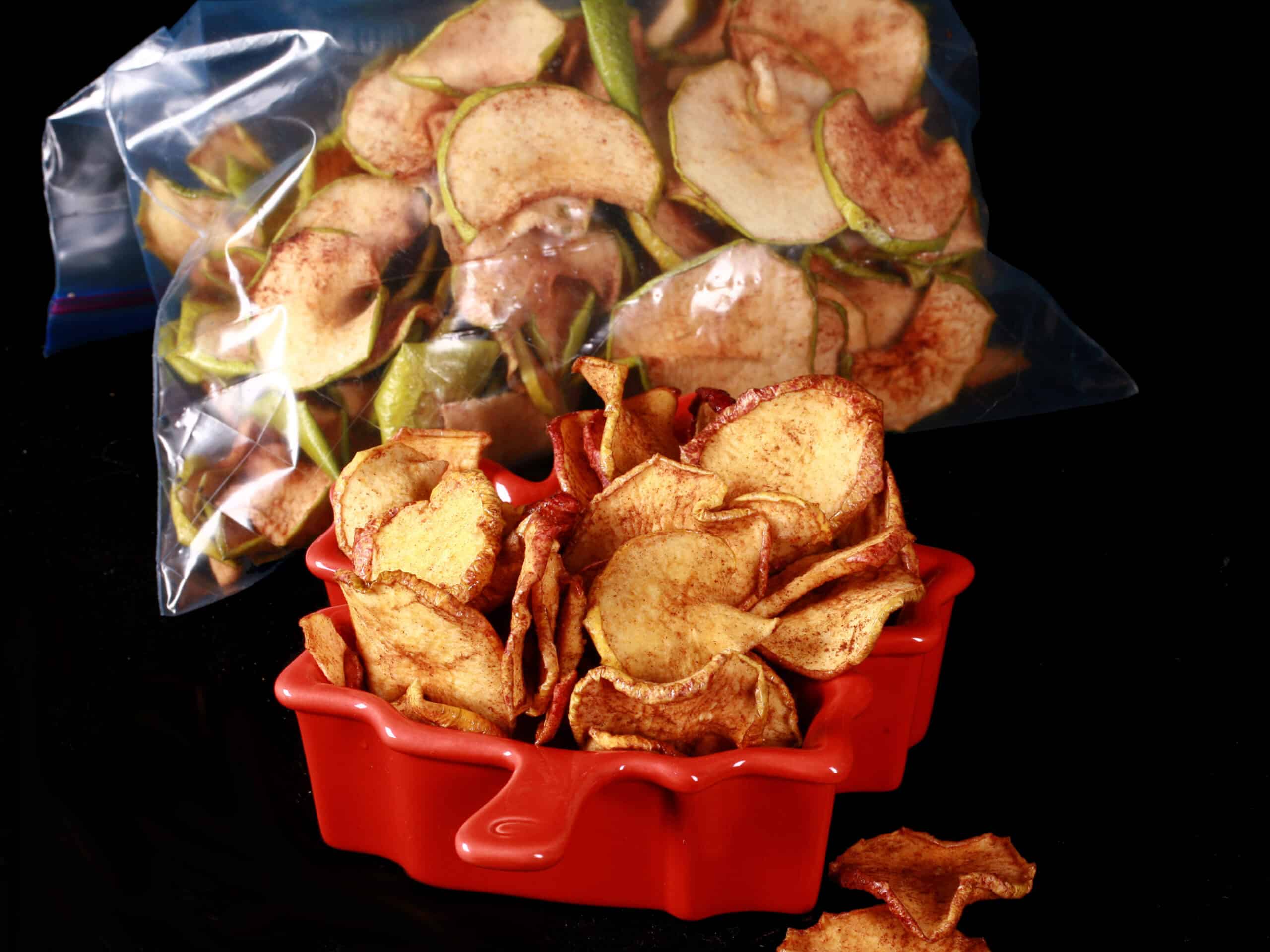 A bowl of homemade maple cinnamon apple chips.