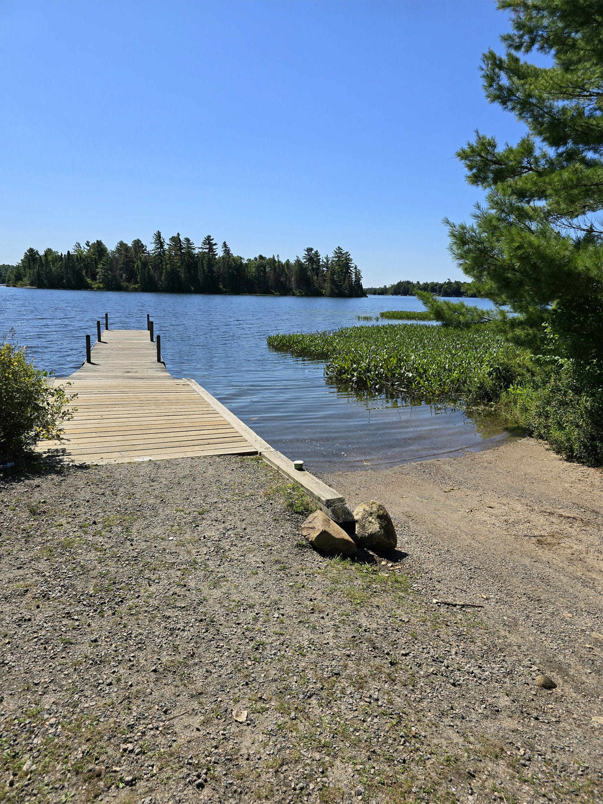 A small boat launch and wooden dock on eagle lake.