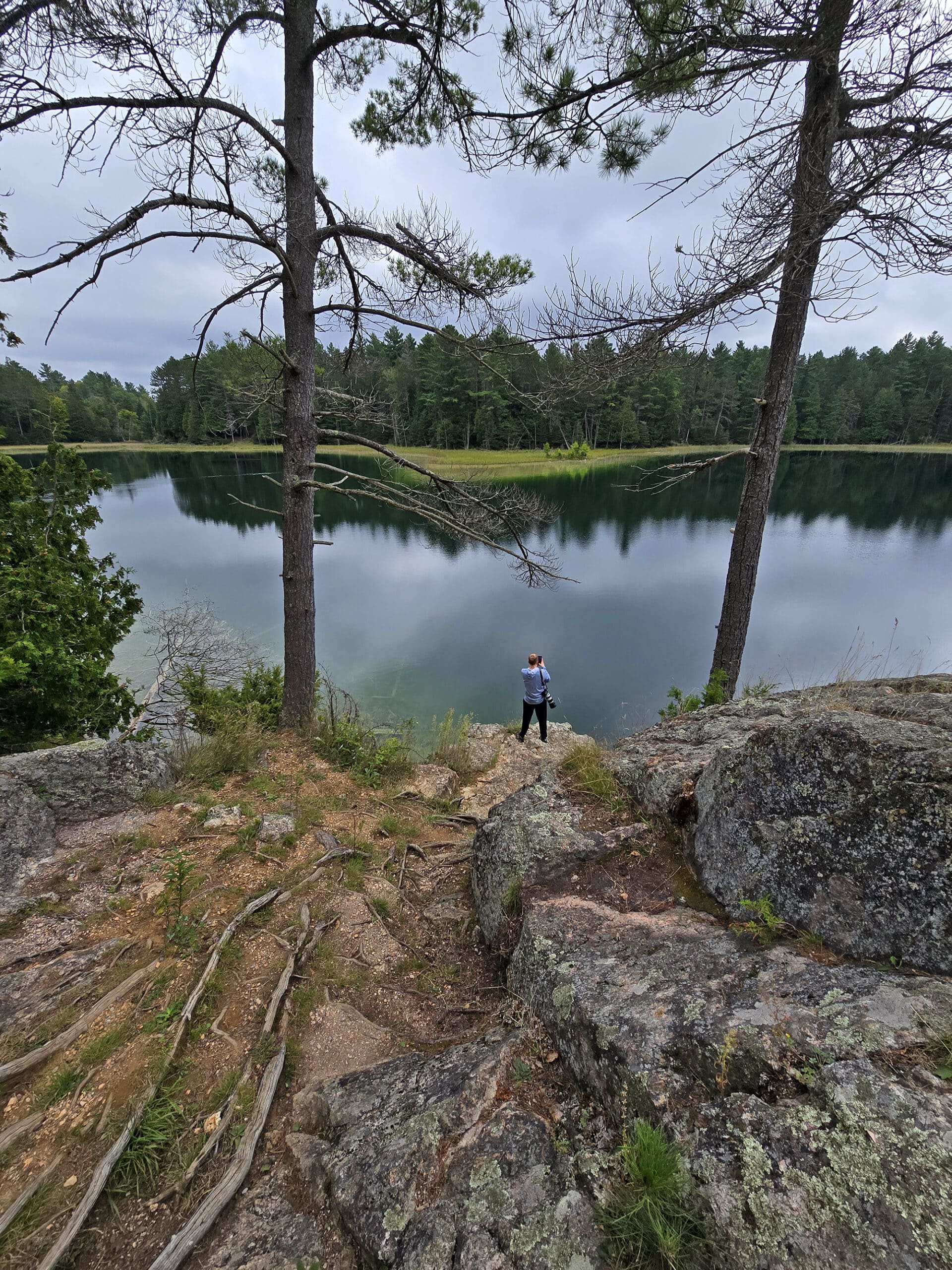 McGinnis Lake, a bright turquoise meromictic lake at Petroglyphs Provincial Park.