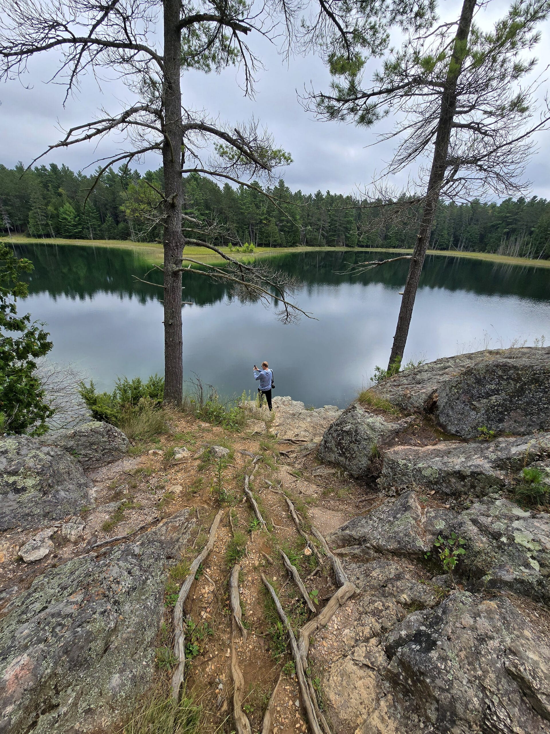 McGinnis Lake, a bright turquoise meromictic lake at Petroglyphs Provincial Park.