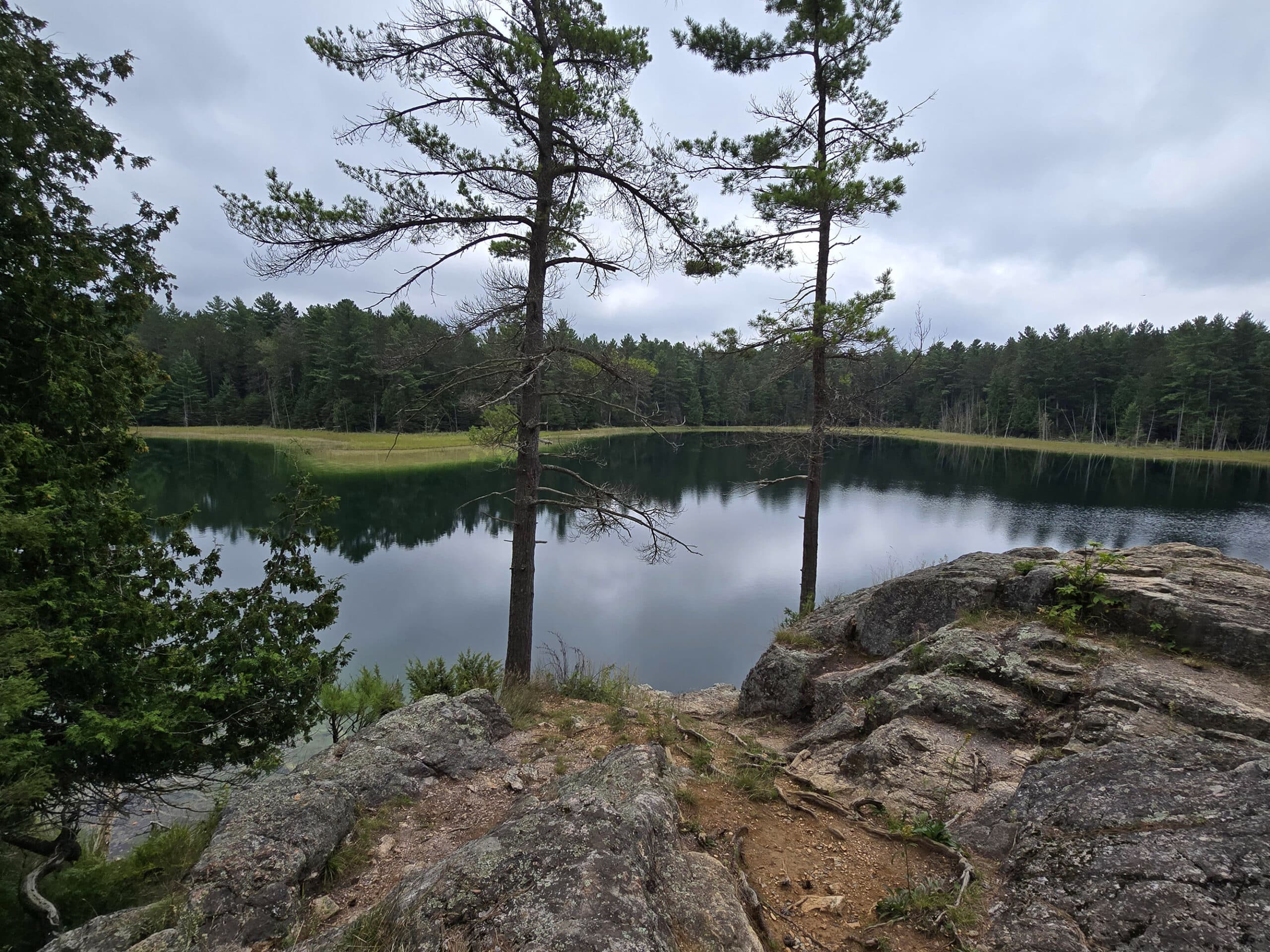 McGinnis Lake, a bright turquoise meromictic lake at Petroglyphs Provincial Park.