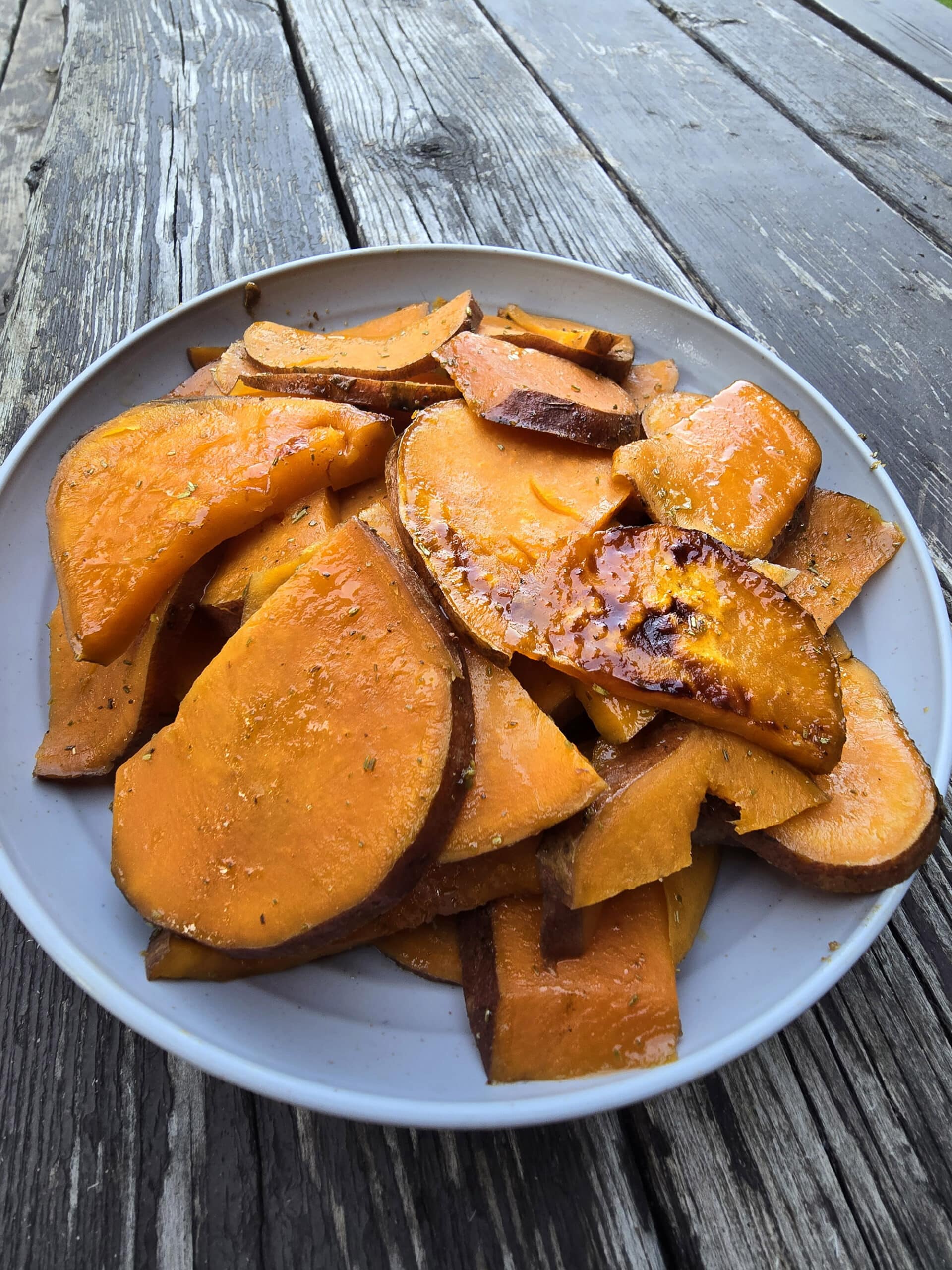 A plate of rosemary maple syrup sweet potatoes.