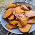 A plate of rosemary maple sweet potato slices.