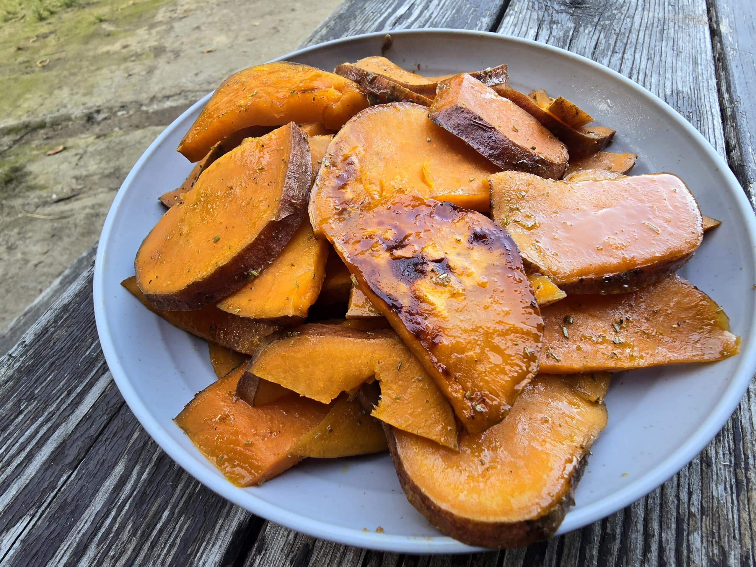 A plate of rosemary maple sweet potato slices.