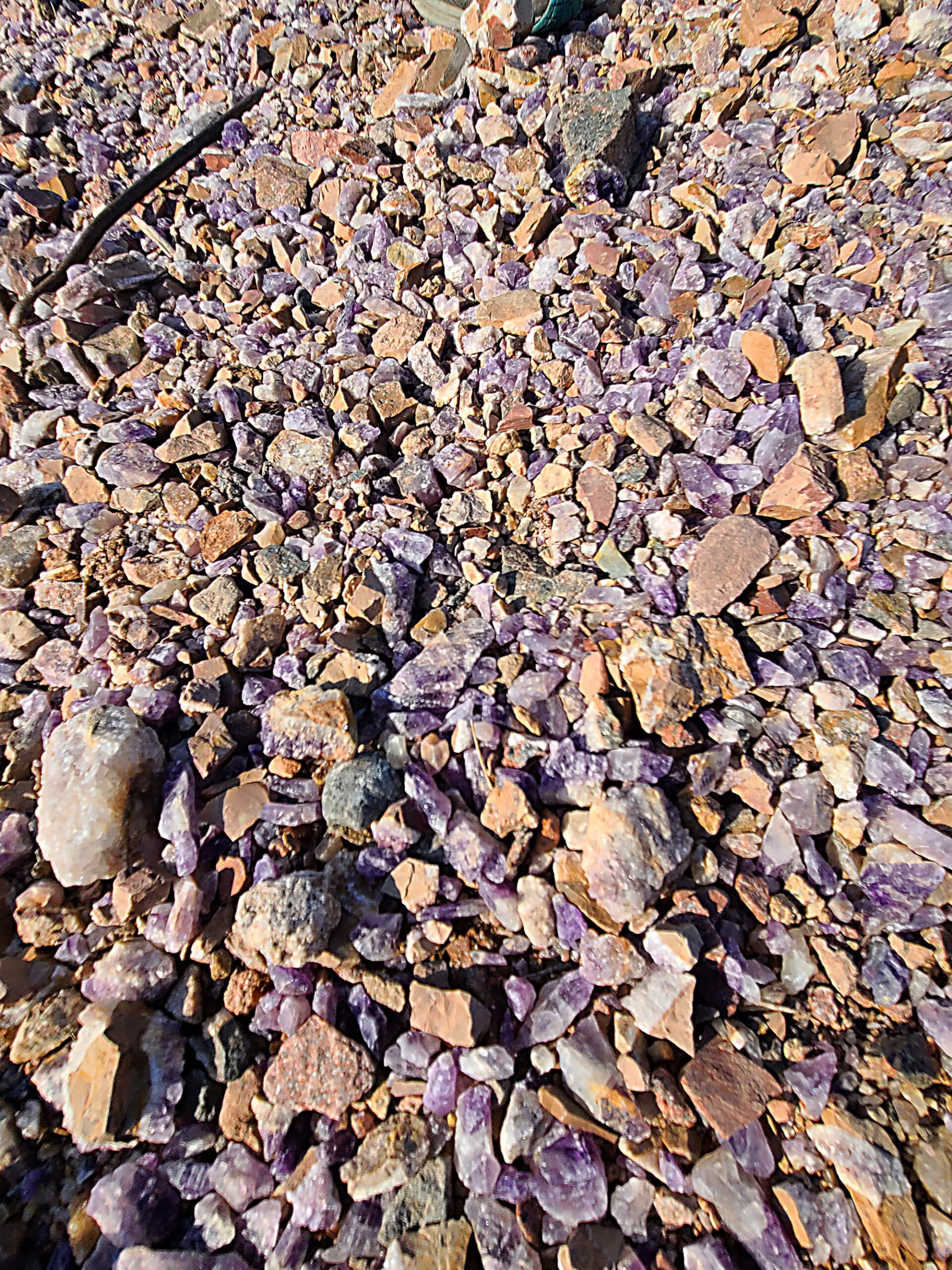 Piles of unrefined amethysts underfoot.