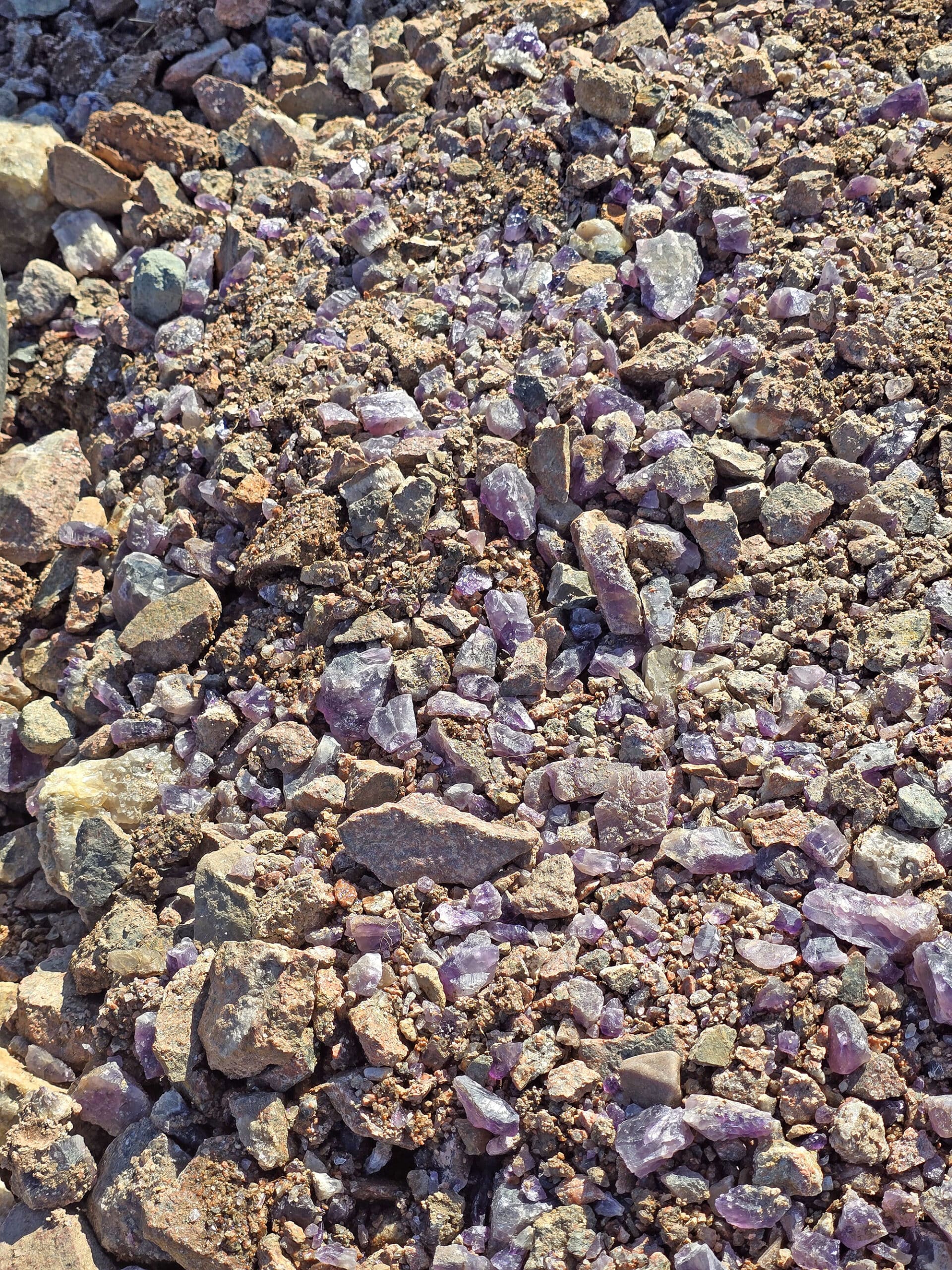 Piles of unrefined amethysts underfoot.