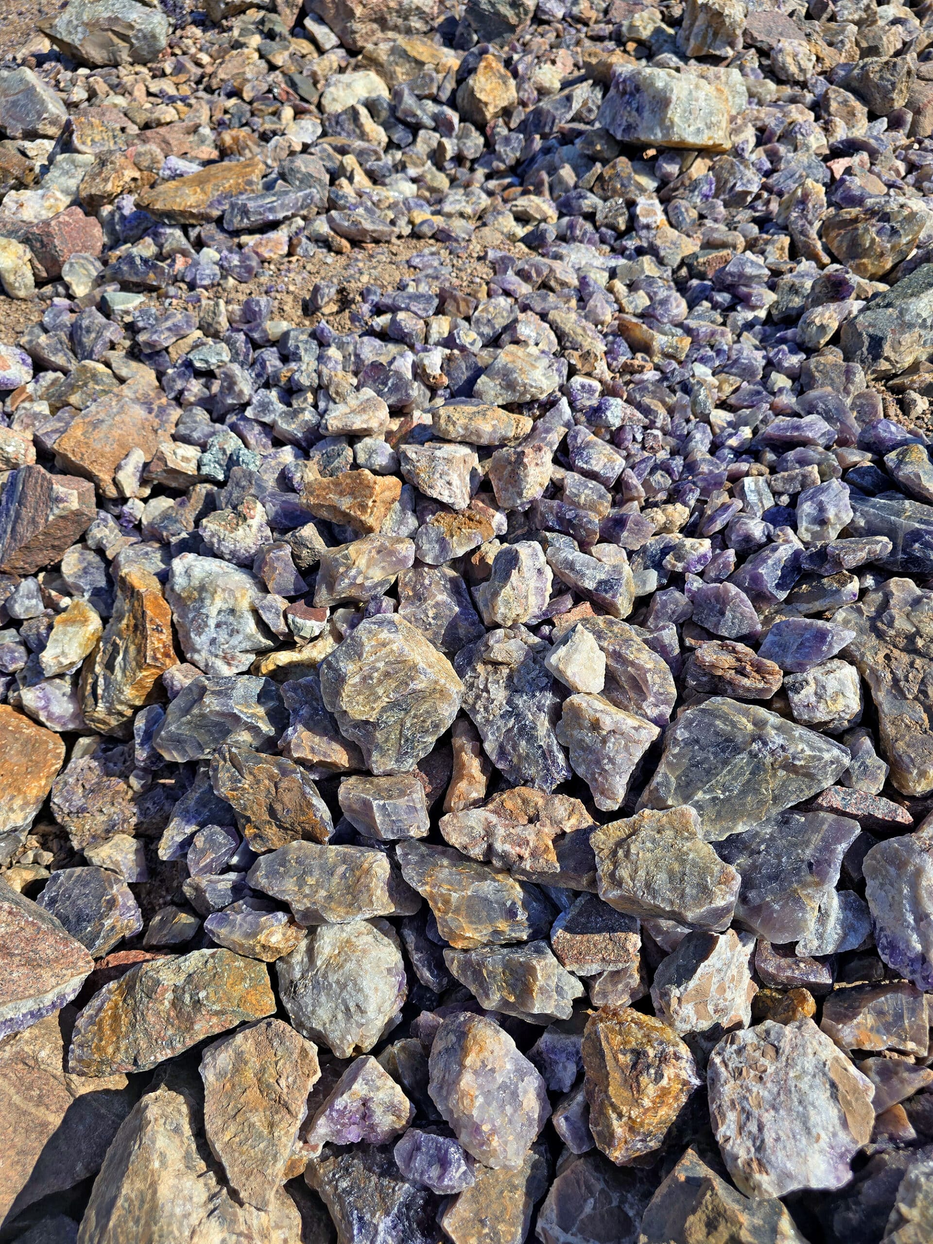 Piles of unrefined amethysts underfoot.