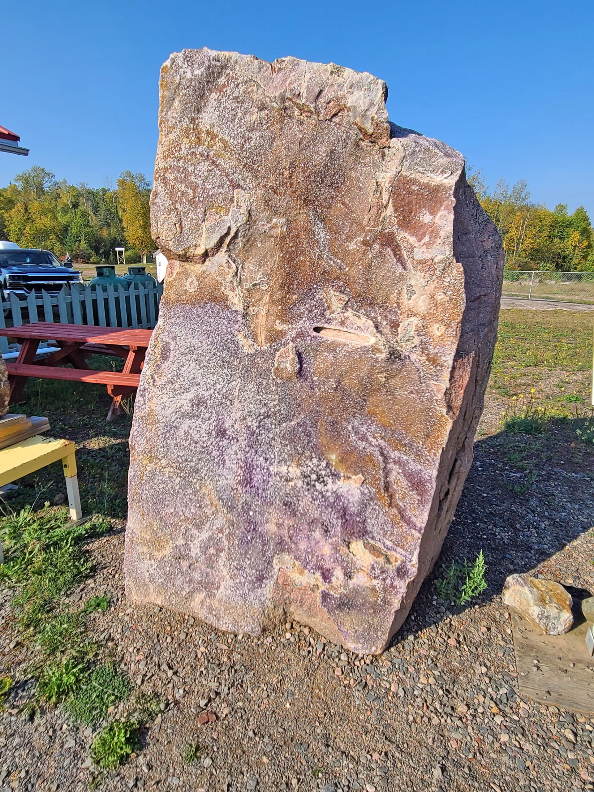 A large rock covered in amethysts.