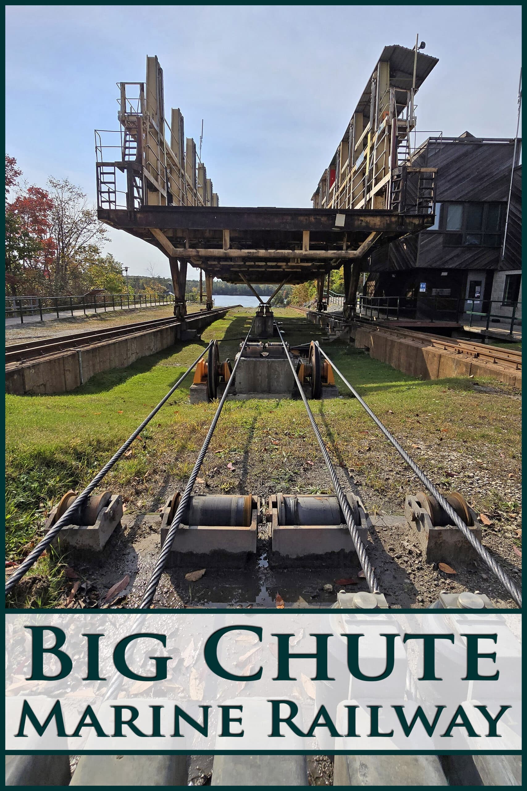 A wide angle view looking up at a marine rail carriage. Overlaid text says big chute marine railway.