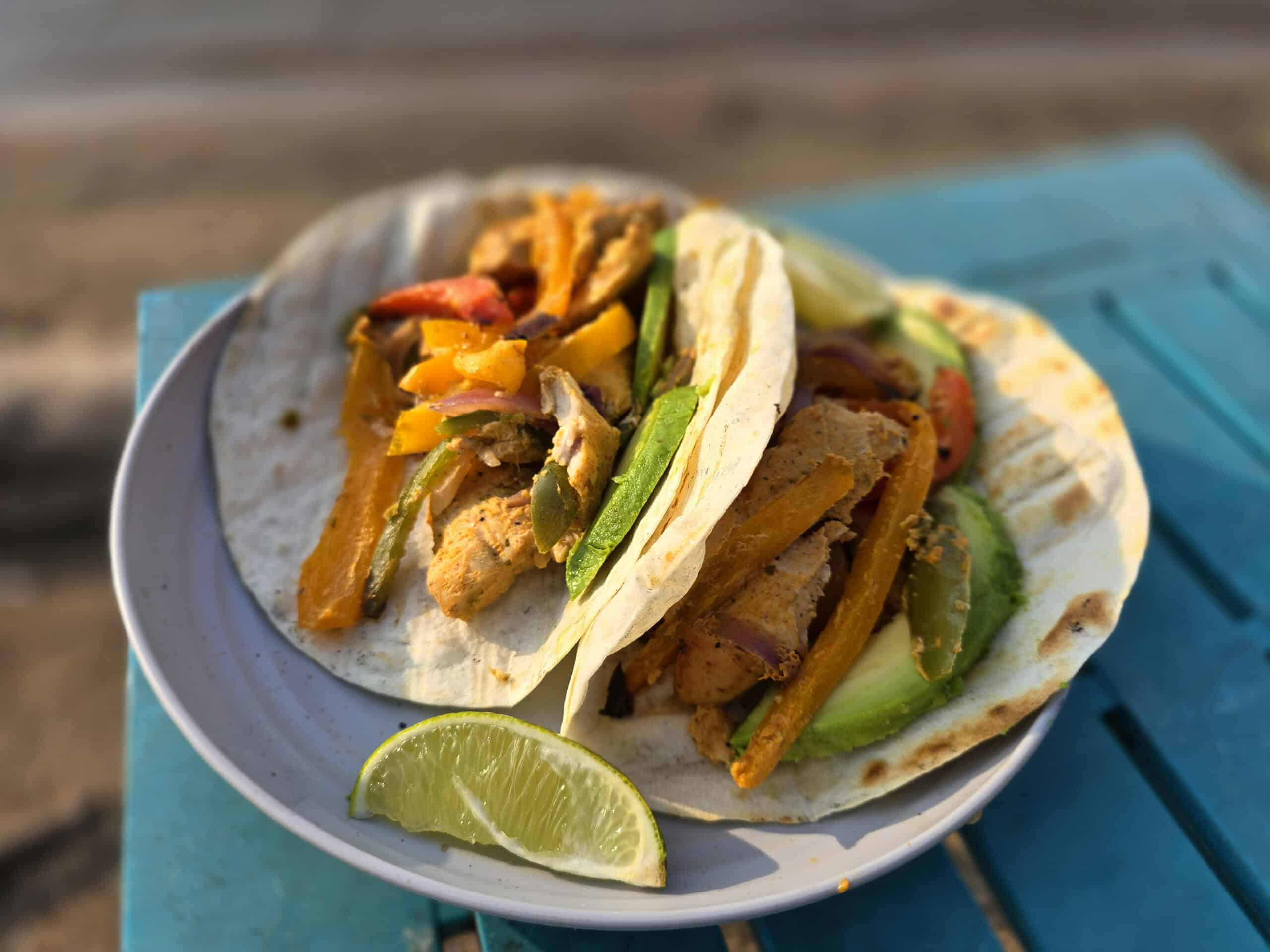 A plate of grilled chicken fajitas.