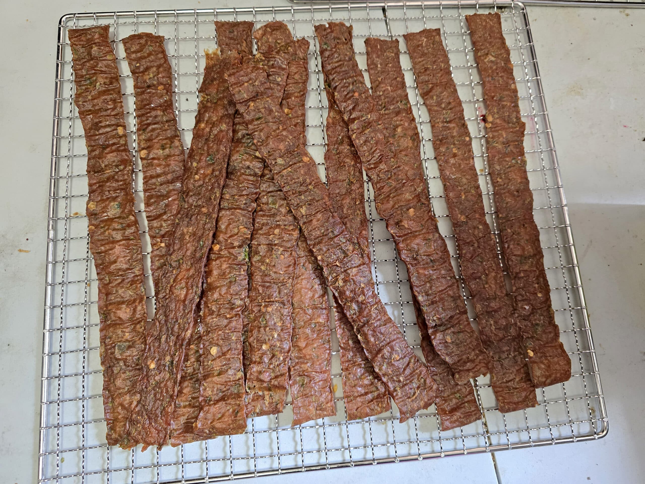 A batch of finished jalapeno chicken jerky.